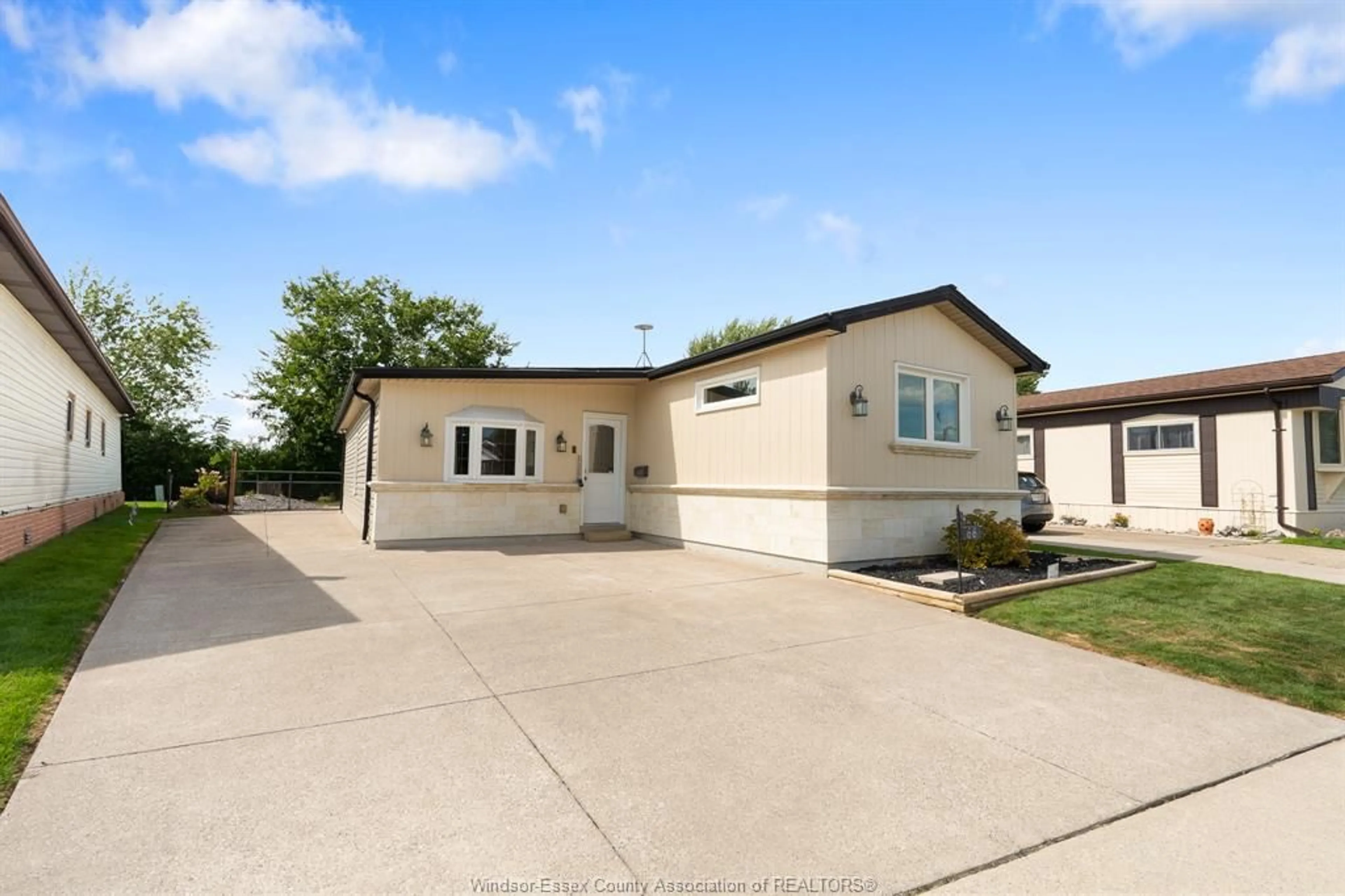 Home with vinyl exterior material, street for 66 Parkside Dr, Essex Ontario N0R 1J0