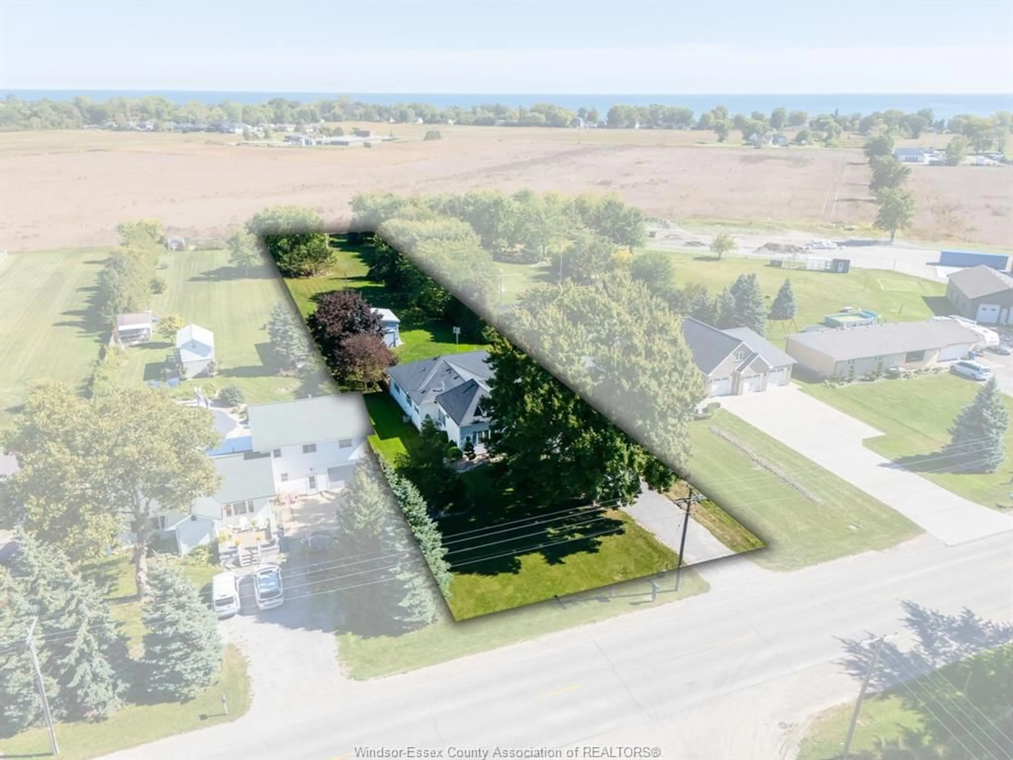 A pic from outside/outdoor area/front of a property/back of a property/a pic from drone, street for 21098 Erie St, Wheatley Ontario N0P 2P0