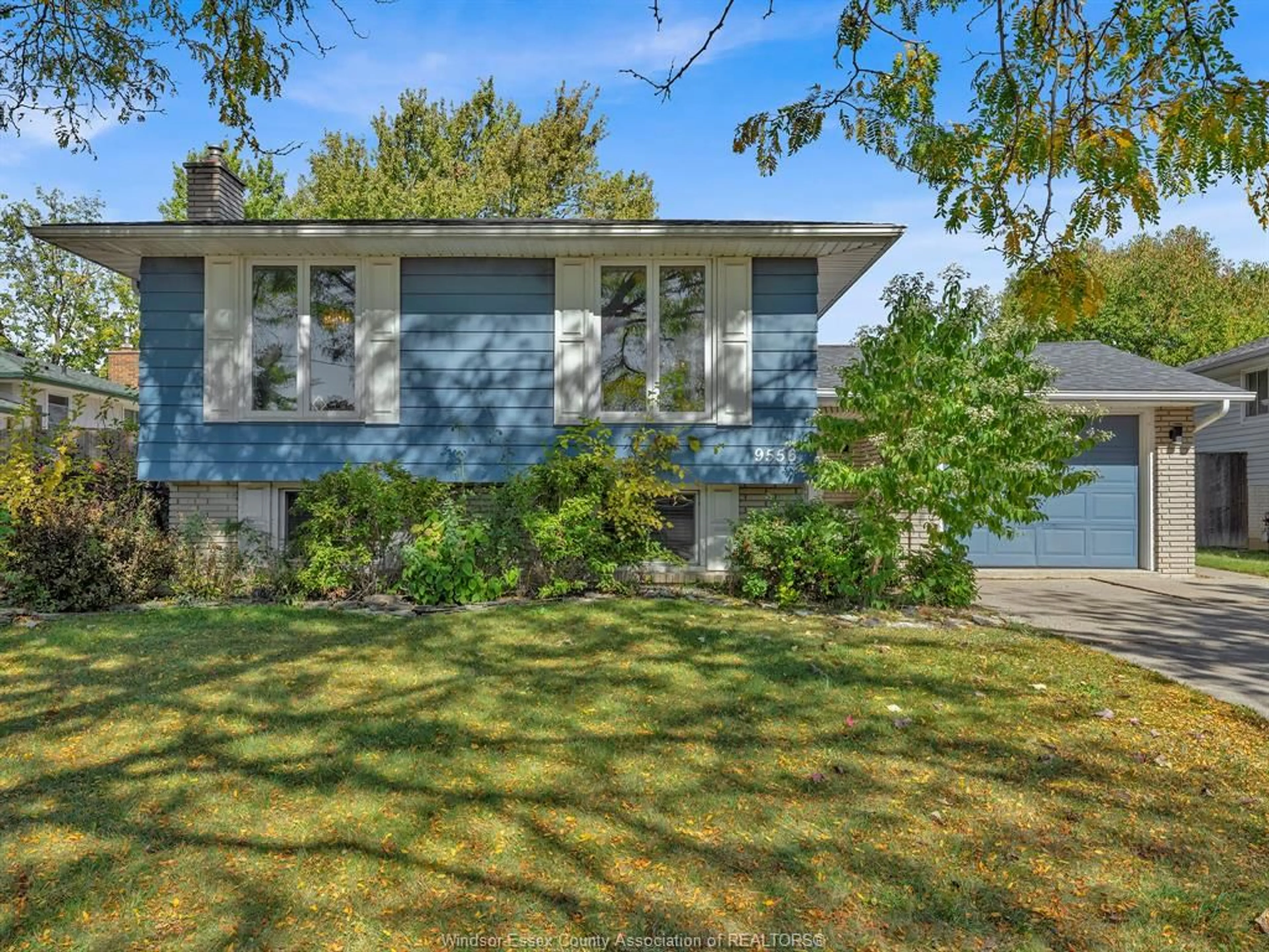 Home with vinyl exterior material, street for 9556 CHESTNUT Dr, Windsor Ontario N8R 1G8