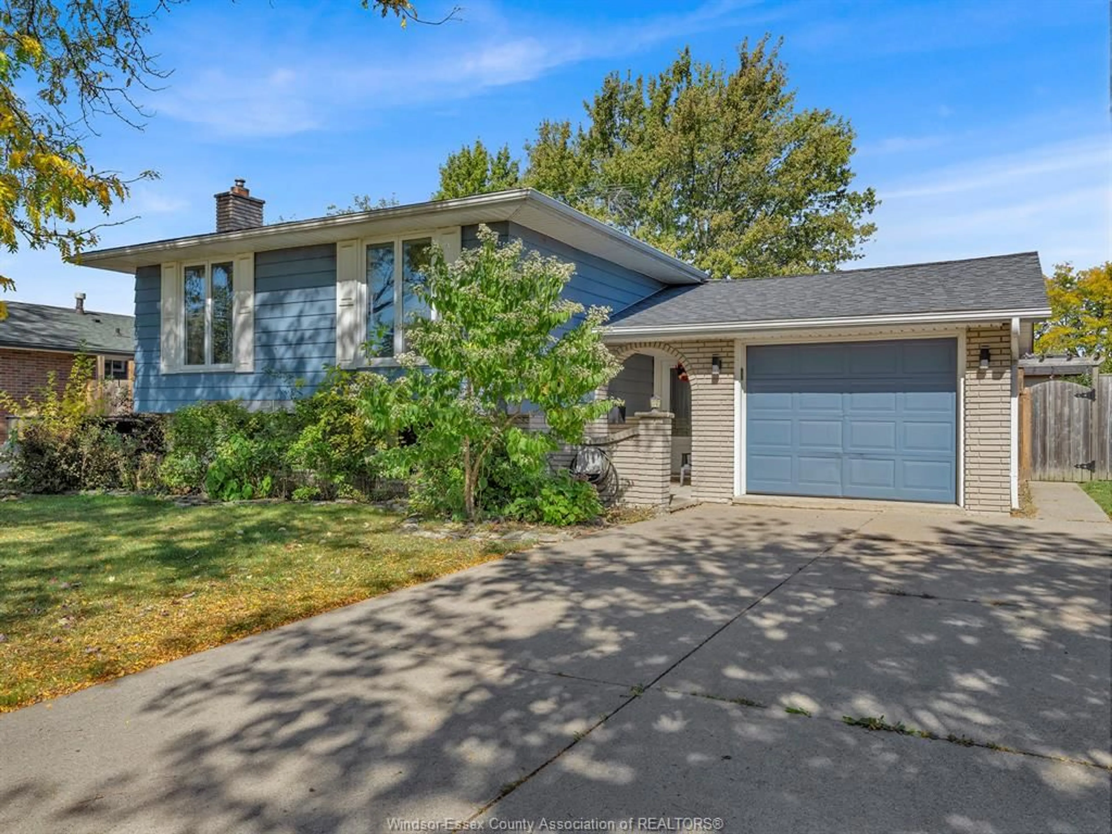 Home with vinyl exterior material, street for 9556 CHESTNUT Dr, Windsor Ontario N8R 1G8