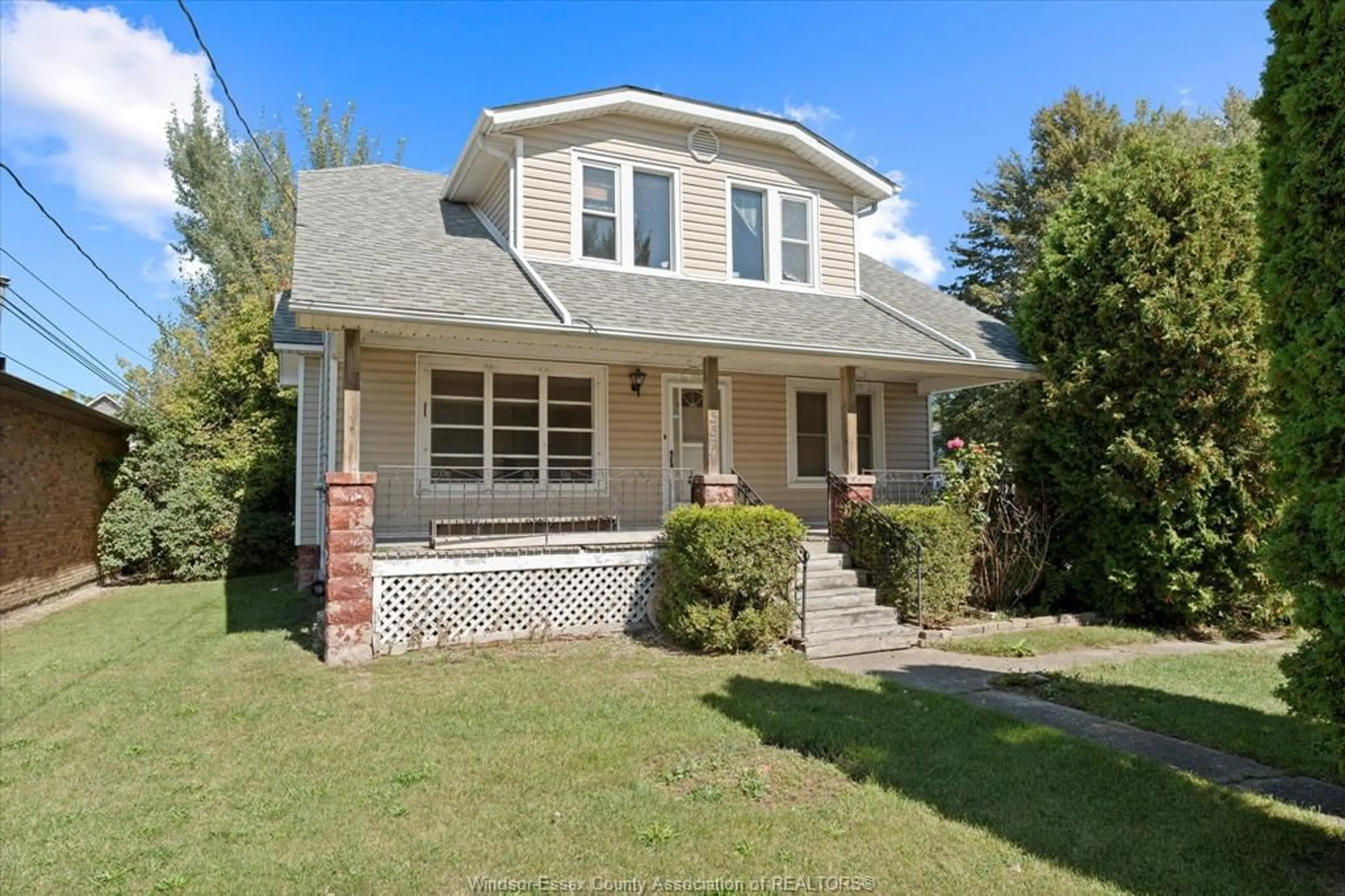 Home with brick exterior material, street for 557 St. Charles St, Belle River Ontario N0R 1A0