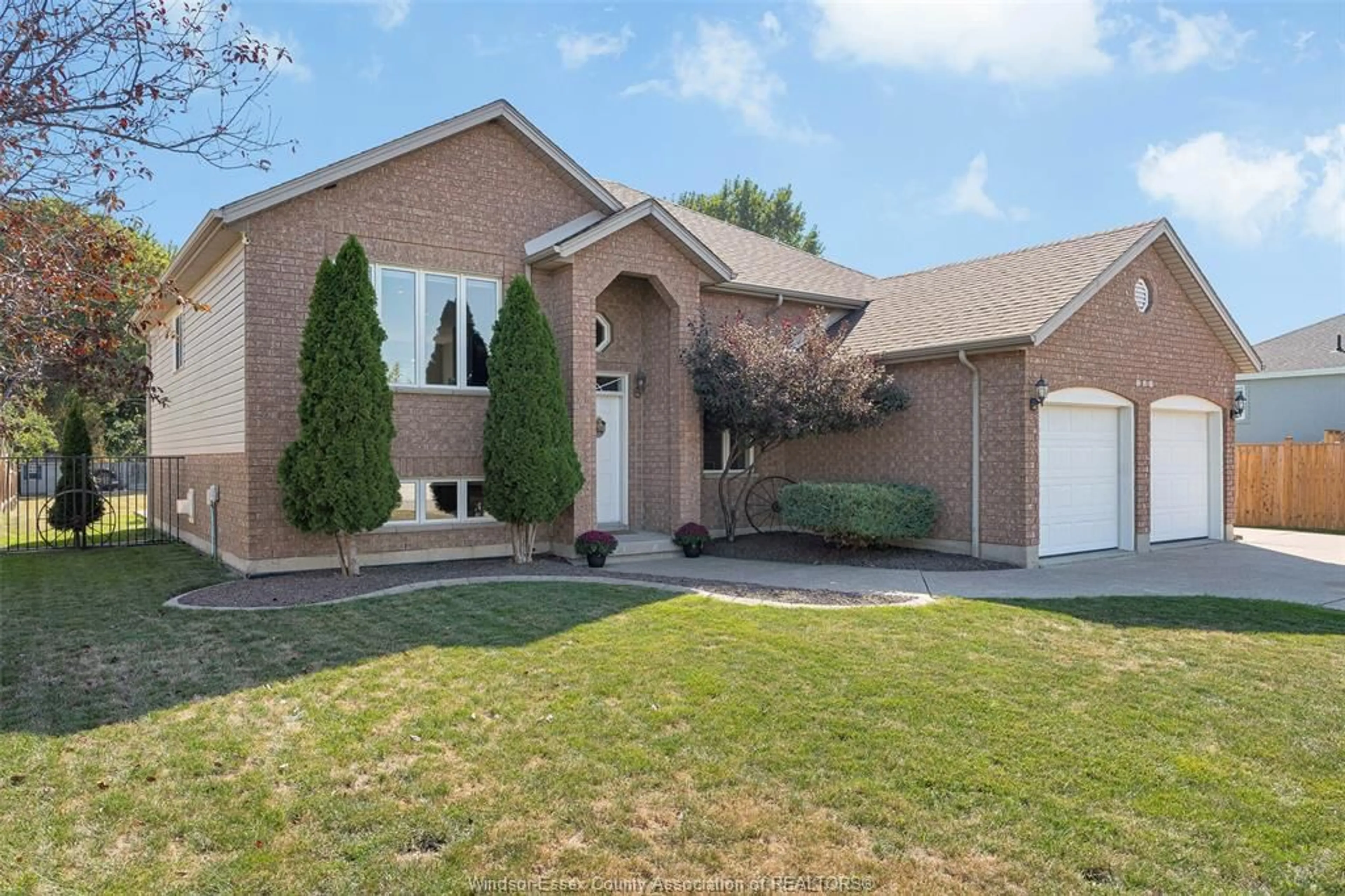 Home with brick exterior material, street for 262 COLUMBUS Dr, Lakeshore Ontario N0R 1N0