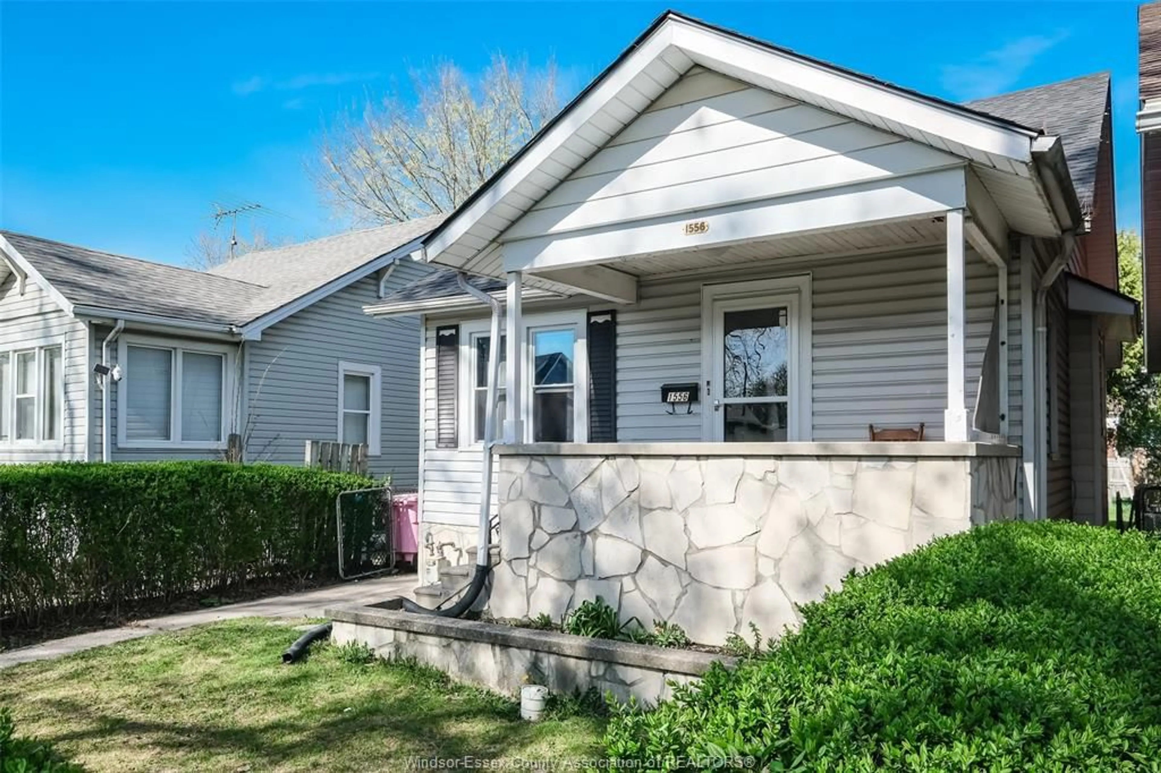 Home with vinyl exterior material, street for 1556 GLADSTONE Ave, Windsor Ontario N8X 2R1