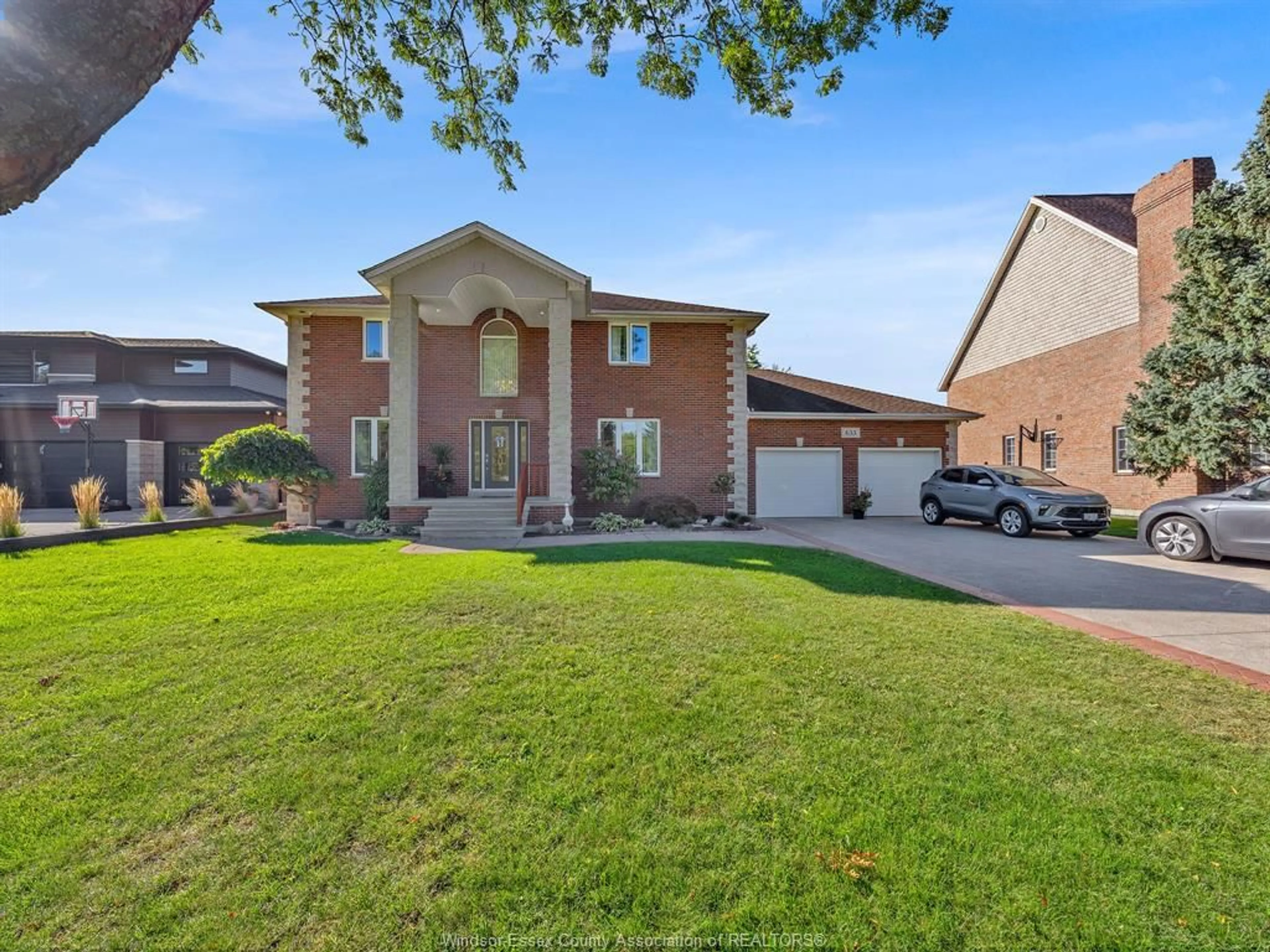 Home with brick exterior material, street for 633 OLD TECUMSEH Rd, Lakeshore Ontario N0R 1A0