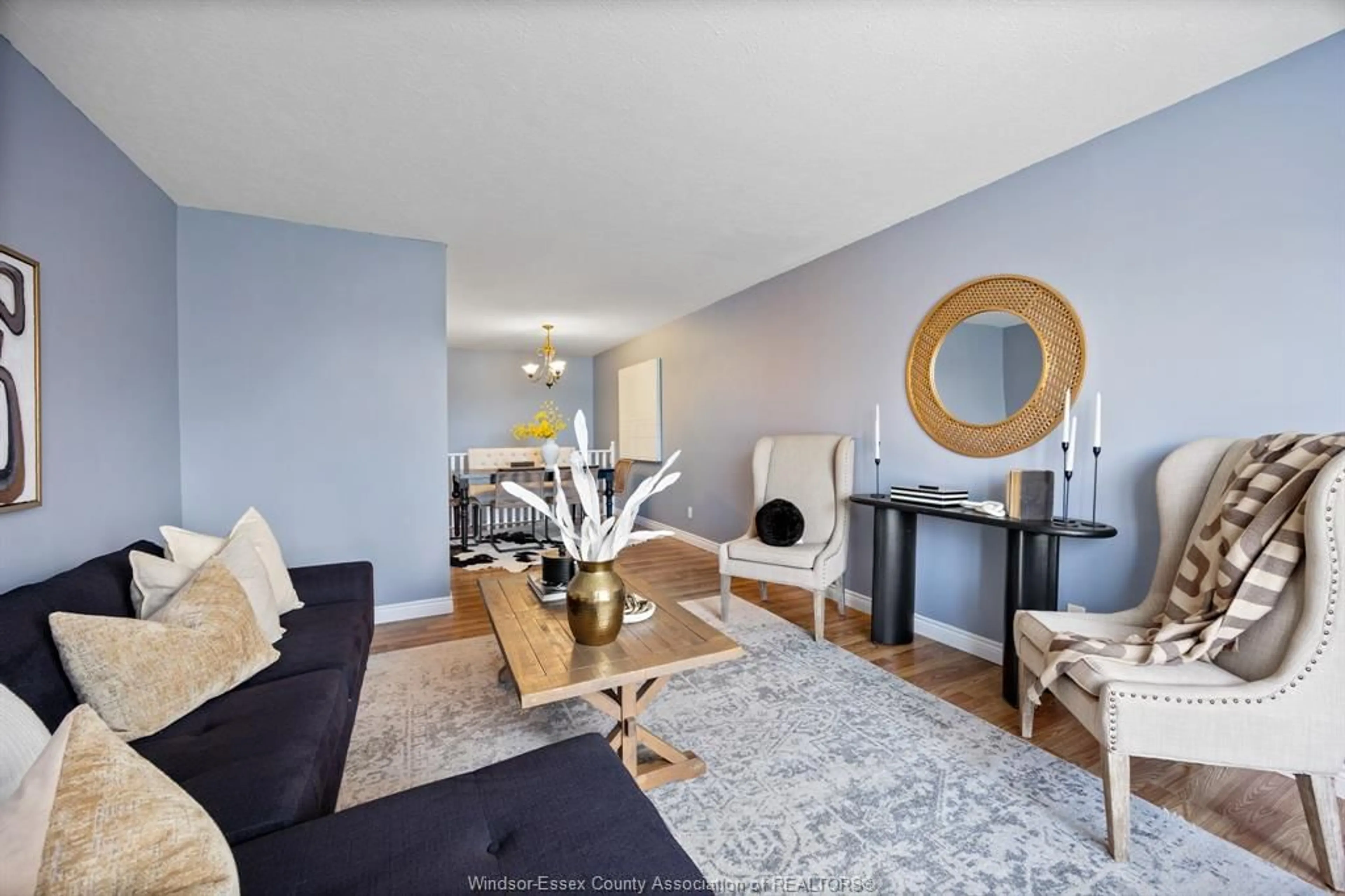 Living room with furniture, wood/laminate floor for 8525 Little River #5, Windsor Ontario N8S 4R3