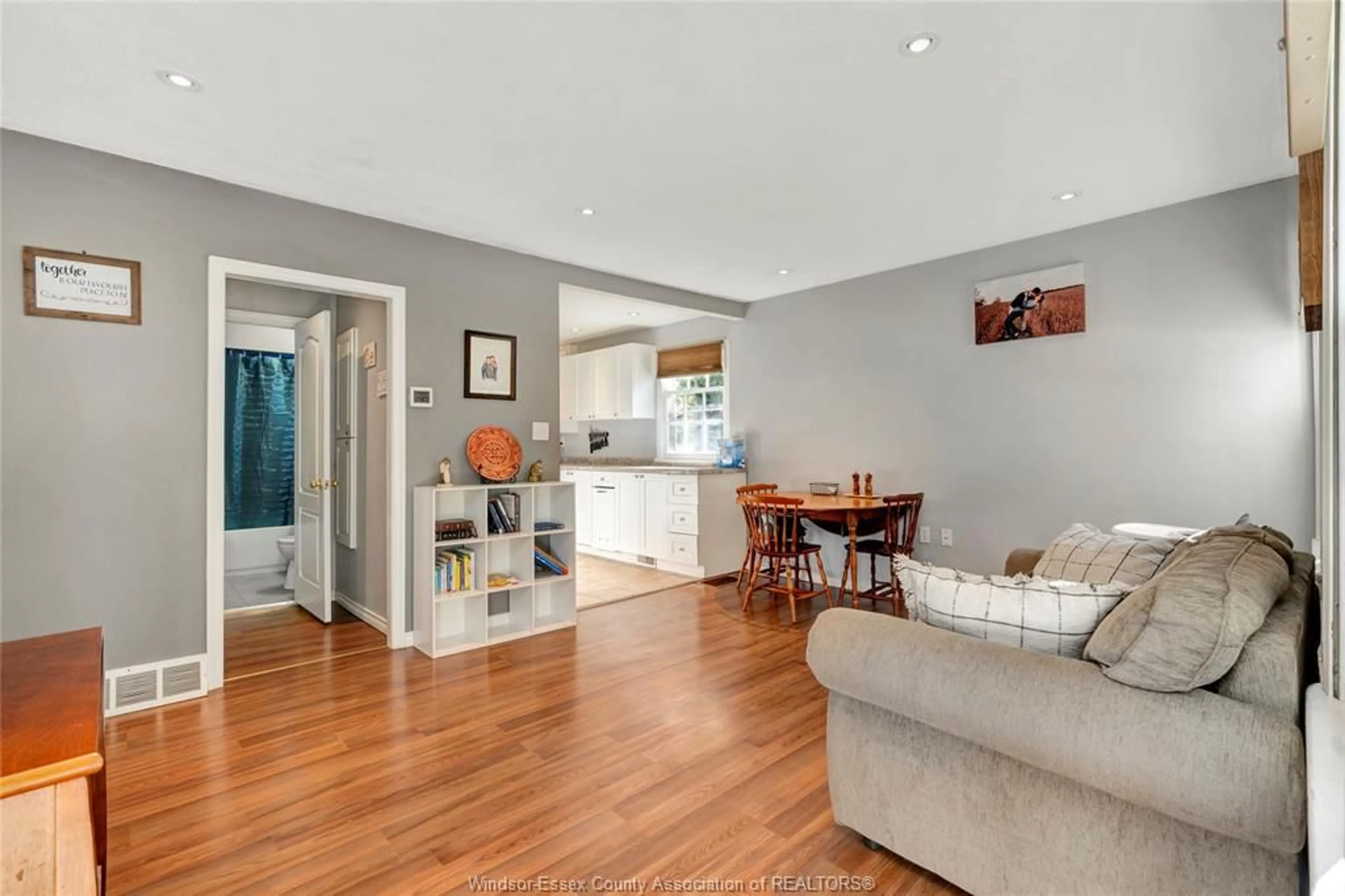 Living room with furniture, wood/laminate floor for 1064 Prince Rd, Windsor Ontario N9C 2Z7