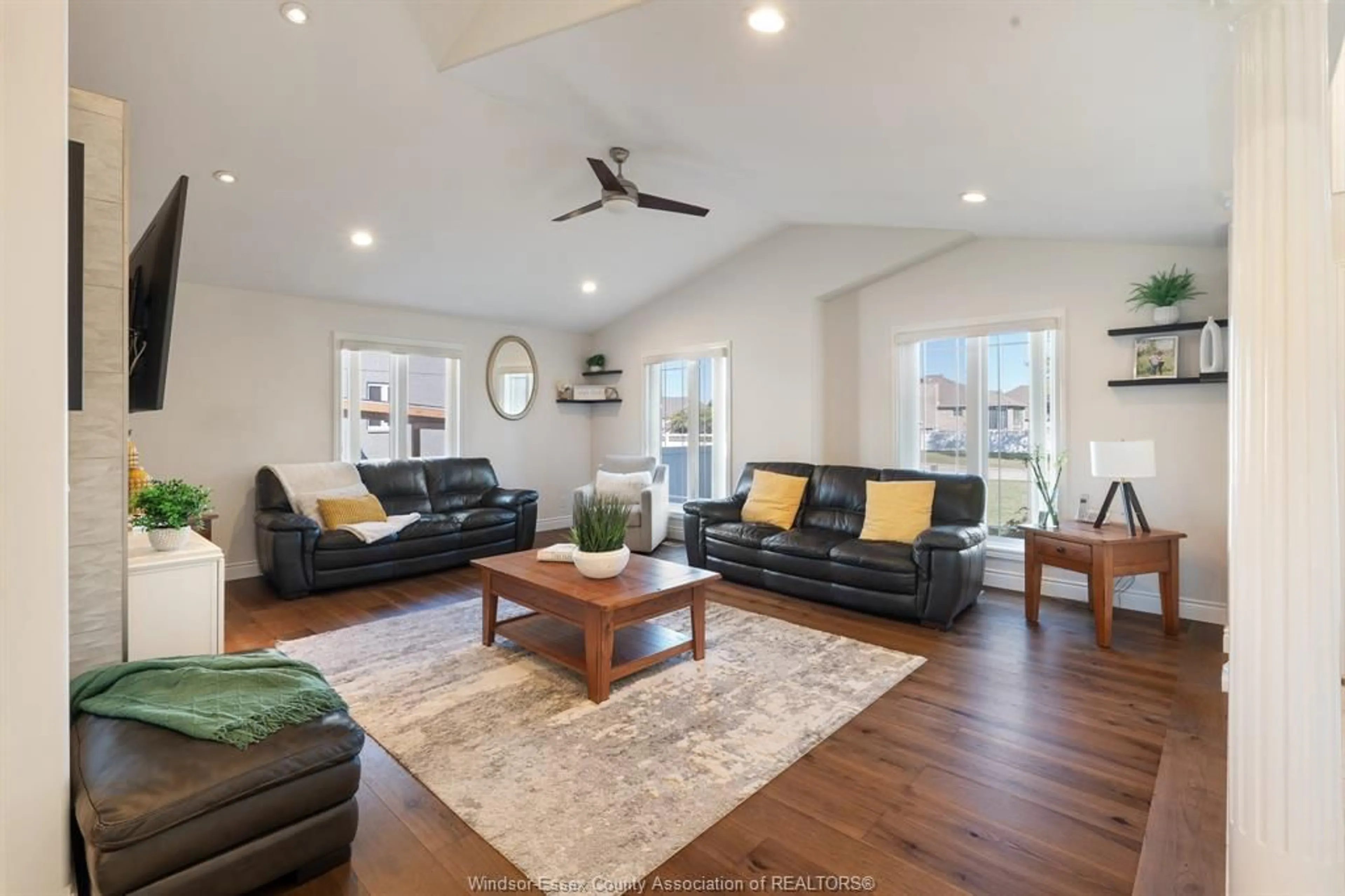 Living room with furniture, wood/laminate floor for 11933 Maisonneuve St, Tecumseh Ontario N9N 1R2