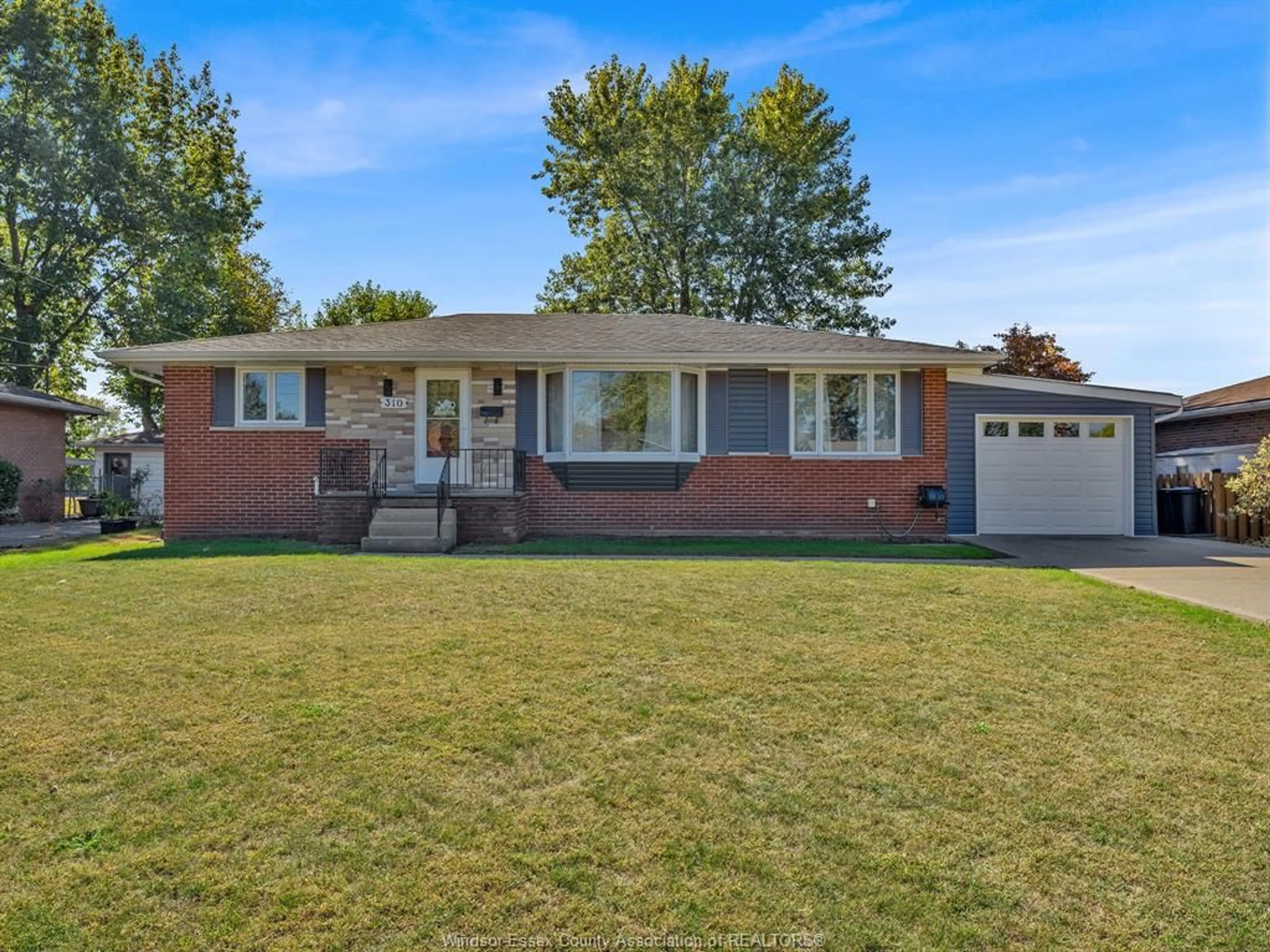 Home with brick exterior material, street for 310 MARTIN Lane, LaSalle Ontario N9J 2M3