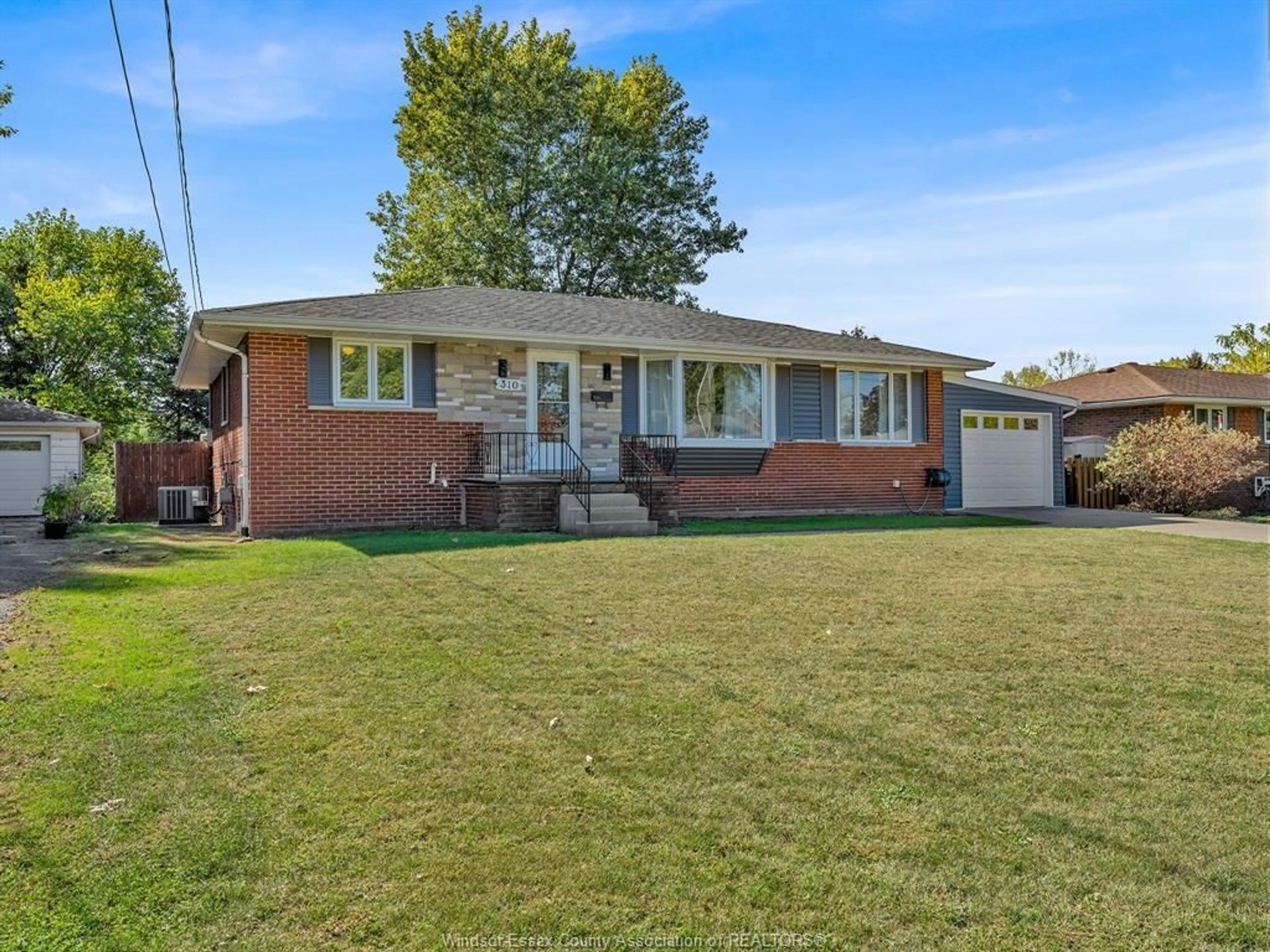 Home with brick exterior material, street for 310 MARTIN Lane, LaSalle Ontario N9J 2M3