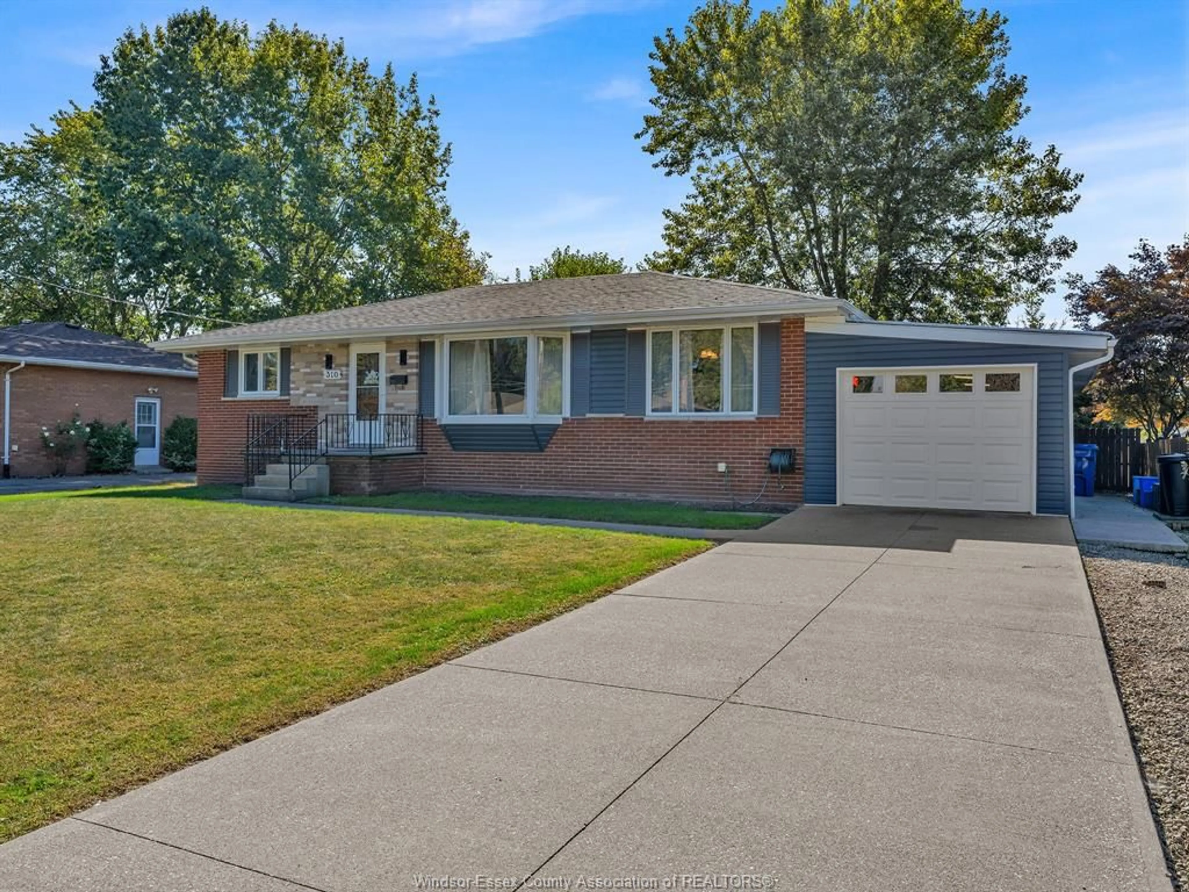 Home with brick exterior material, street for 310 MARTIN Lane, LaSalle Ontario N9J 2M3