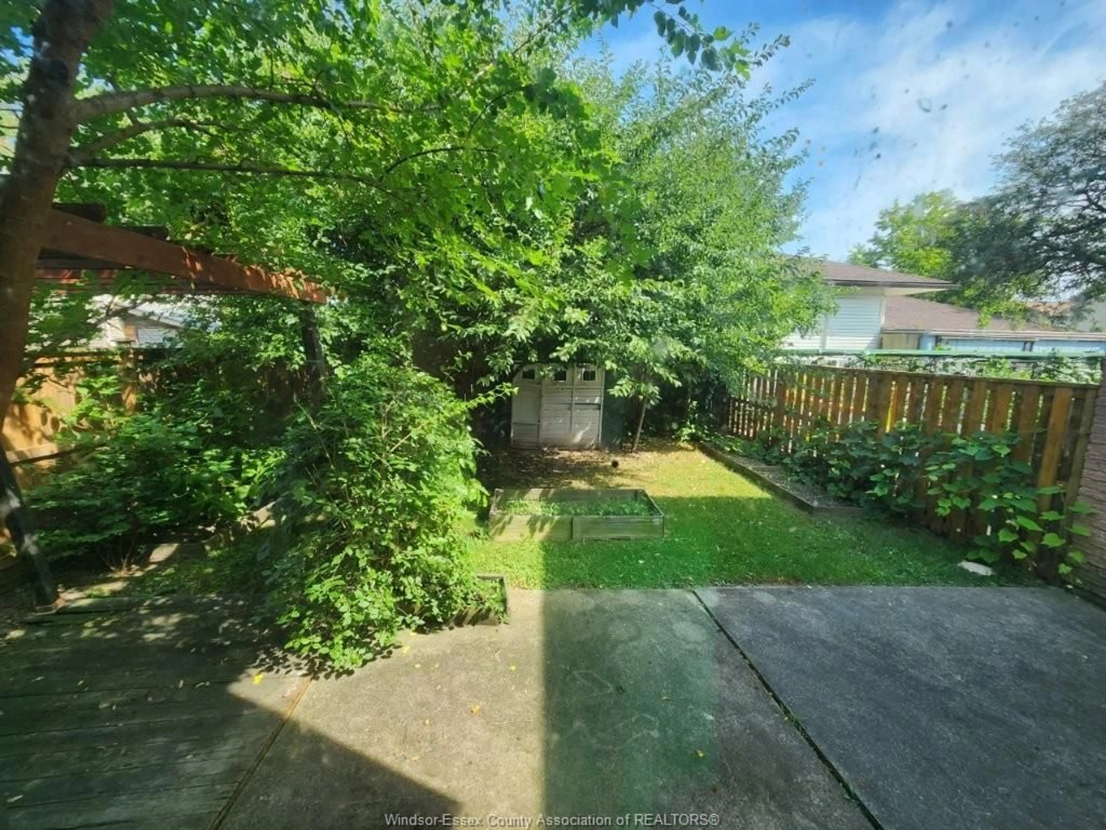 A pic from outside/outdoor area/front of a property/back of a property/a pic from drone, forest/trees view for 9014 COPPERFIELD Crt, Windsor Ontario N8S 4H3