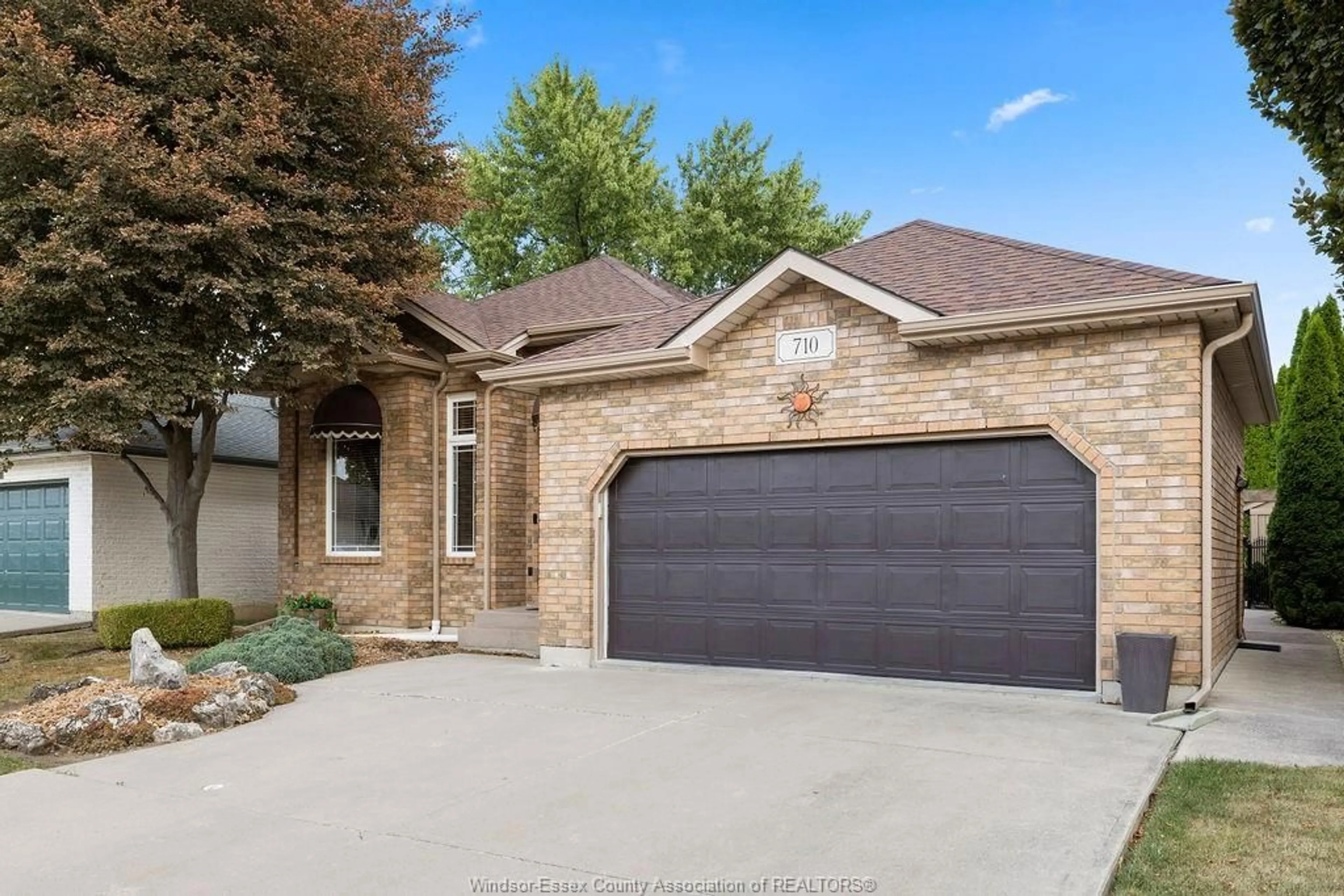 Home with brick exterior material, street for 710 REVLAND Dr, Tecumseh Ontario N8N 5B1