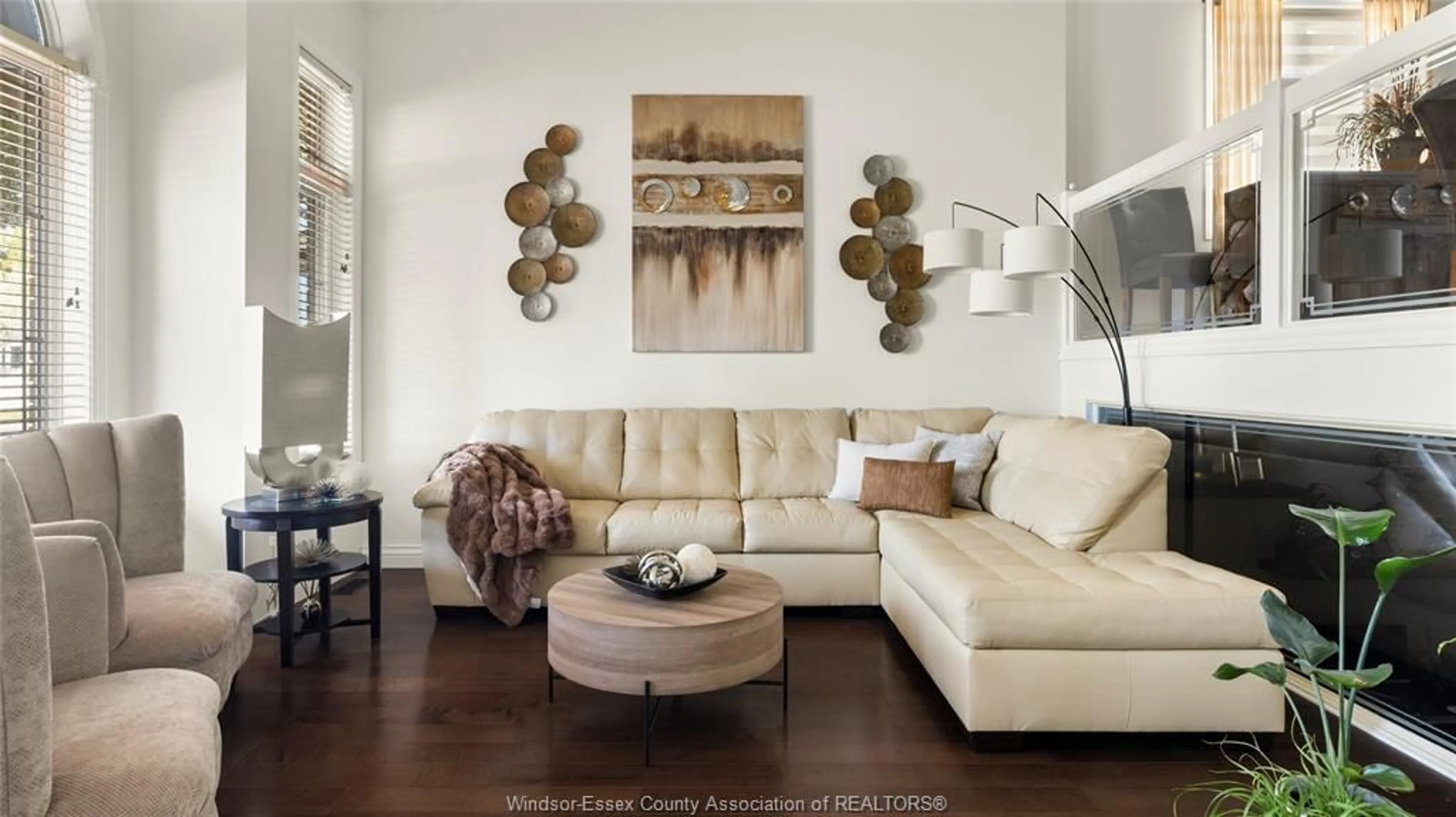 Living room with furniture, wood/laminate floor for 710 REVLAND Dr, Tecumseh Ontario N8N 5B1