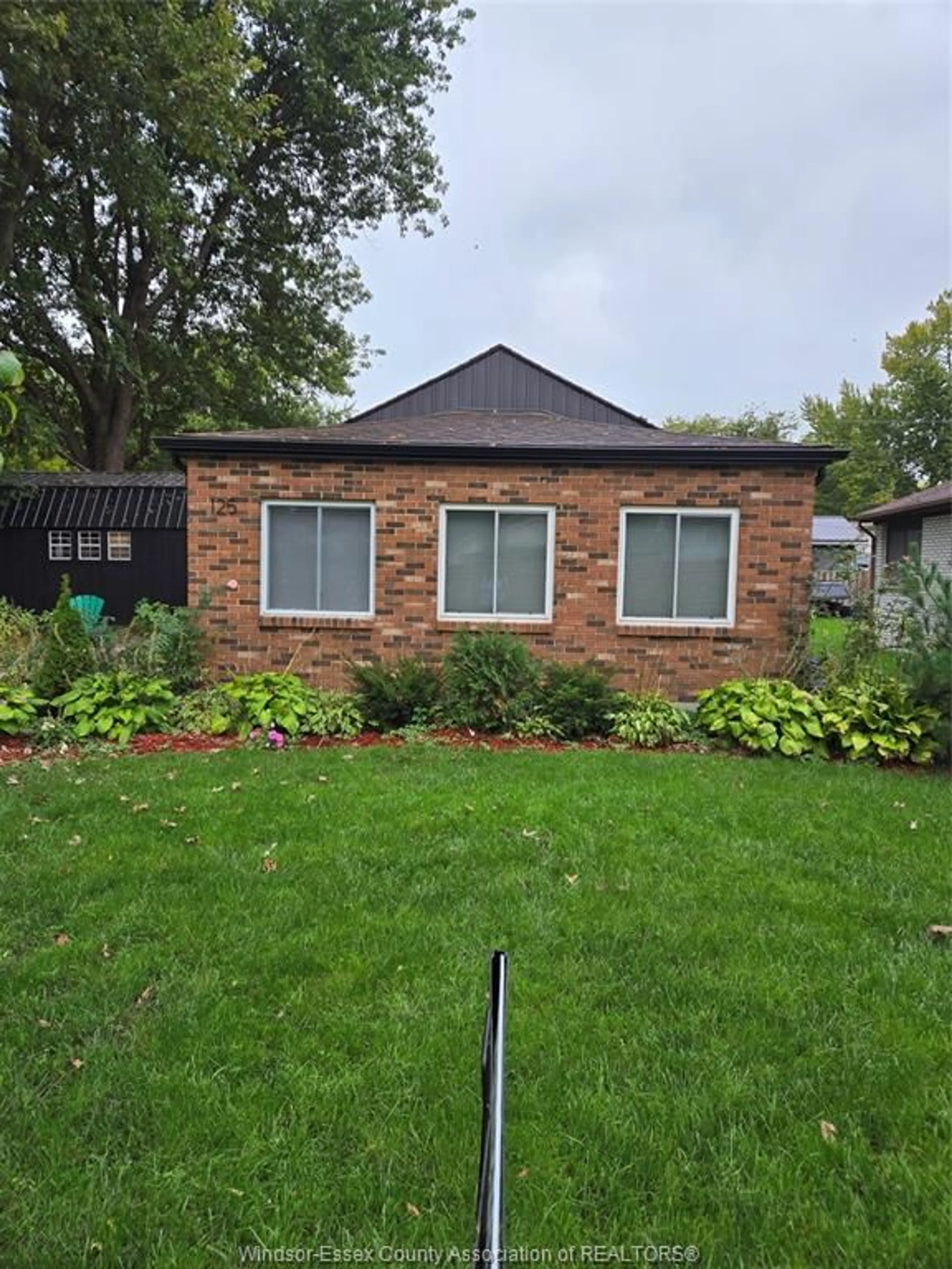 Home with brick exterior material, street for 125 CRYSTAL Lane, Harrow Ontario N0R 1G0