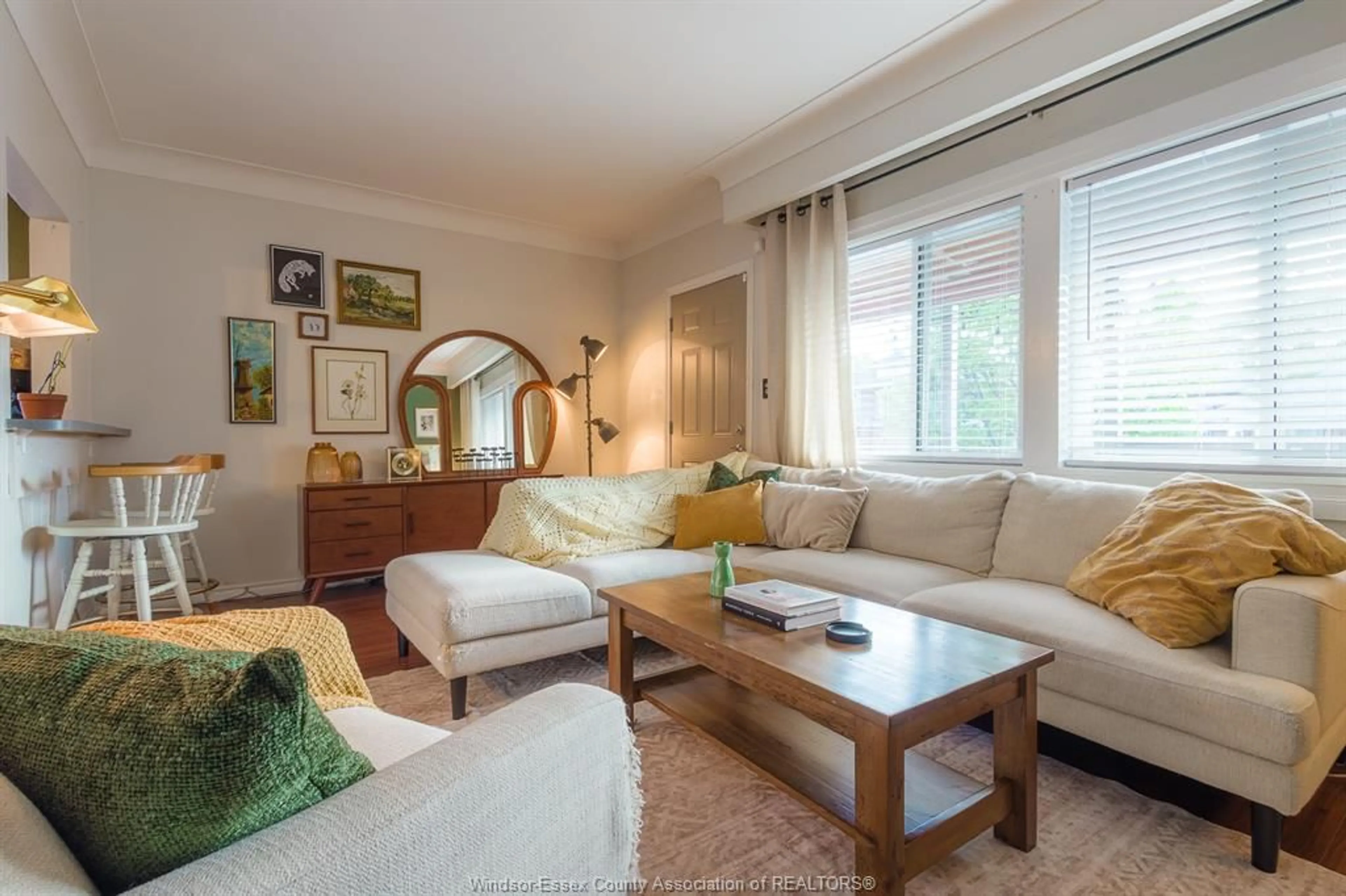 Living room with furniture, wood/laminate floor for 1338 Goyeau St, Windsor Ontario N8X 3L1