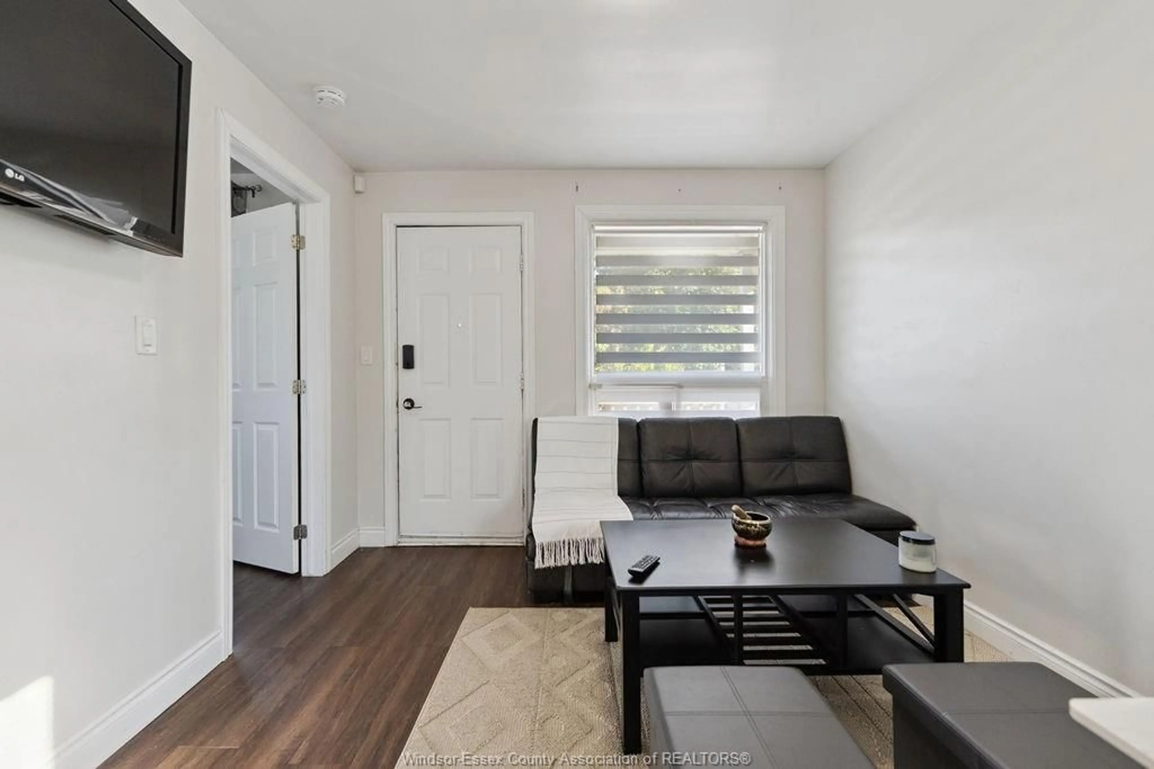 Living room with furniture, wood/laminate floor for 1581 LAING, Windsor Ontario N9B 1N1