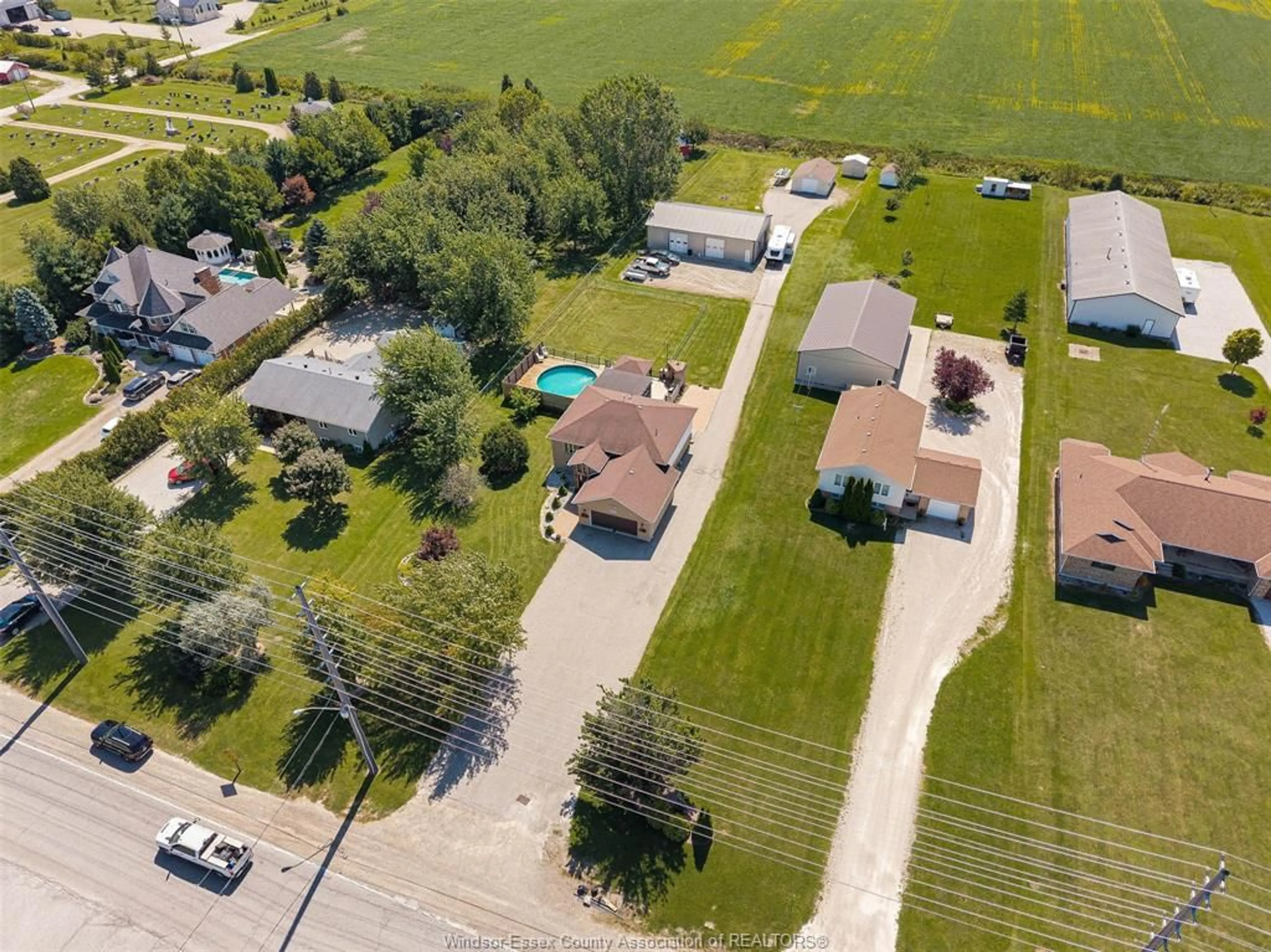 A pic from outside/outdoor area/front of a property/back of a property/a pic from drone, street for 522 COUNTY RD 8, Leamington Ontario N0P 2J0