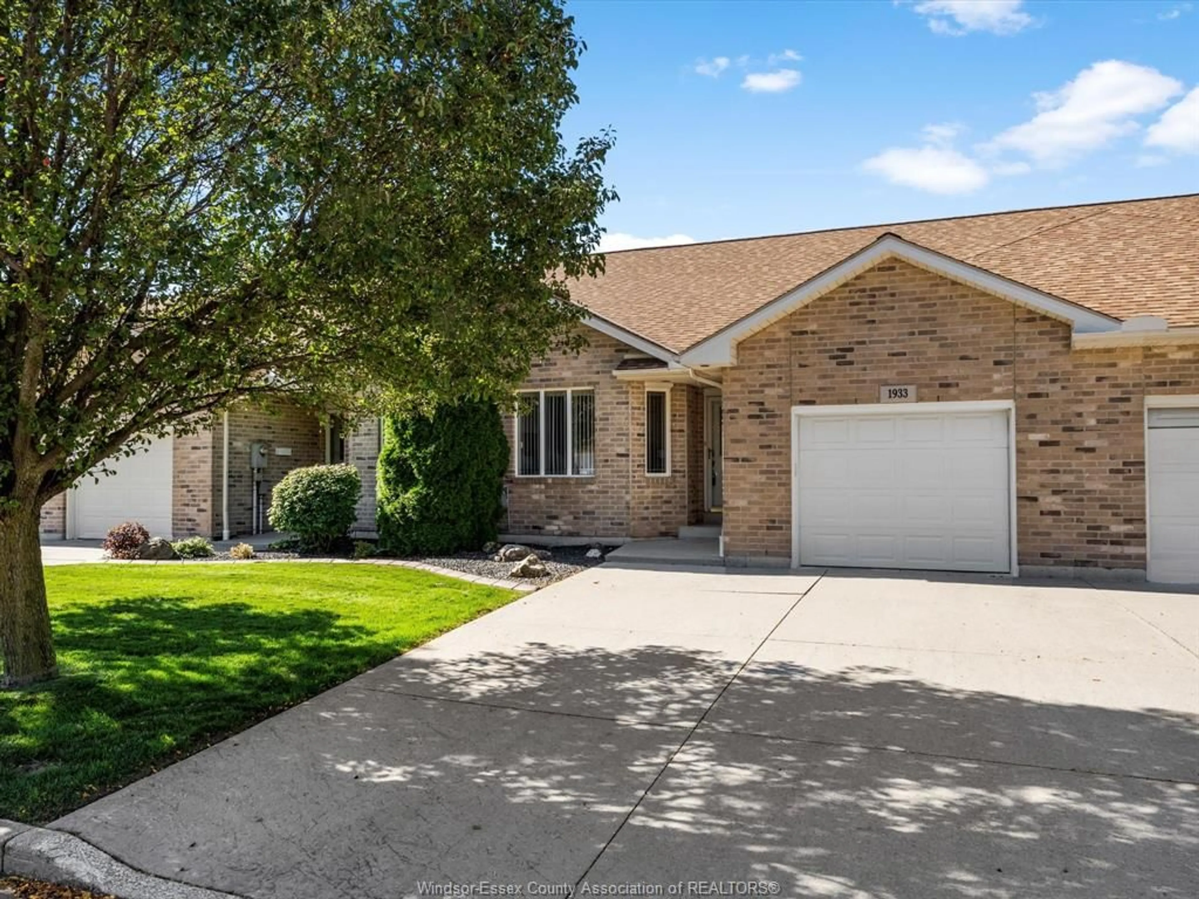 Home with brick exterior material, street for 1933 Morningstar Ave, Windsor Ontario N8P 1W6