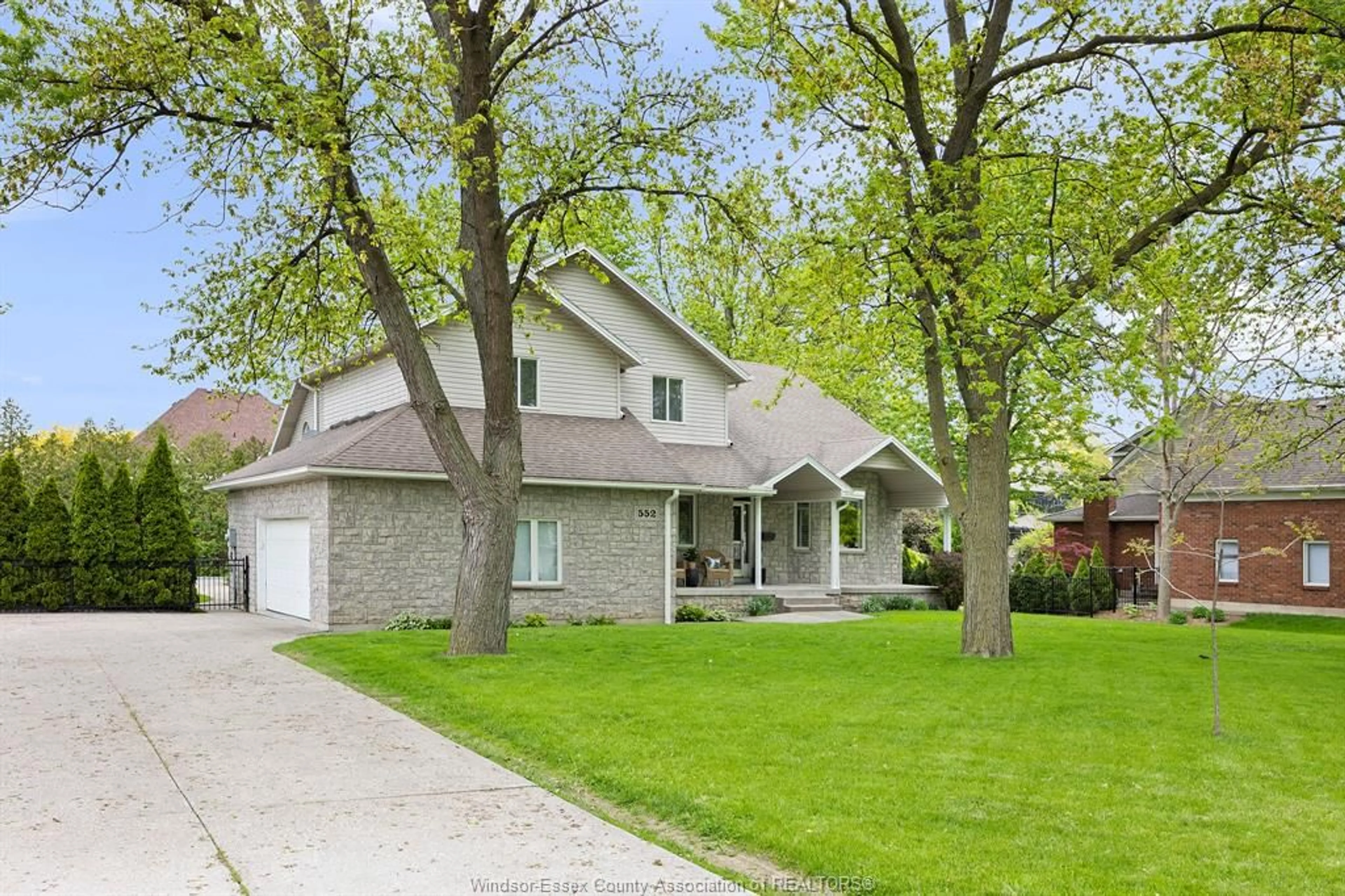 Home with brick exterior material, street for 552 OLD TECUMSEH Rd, Lakeshore Ontario N0R 1A0
