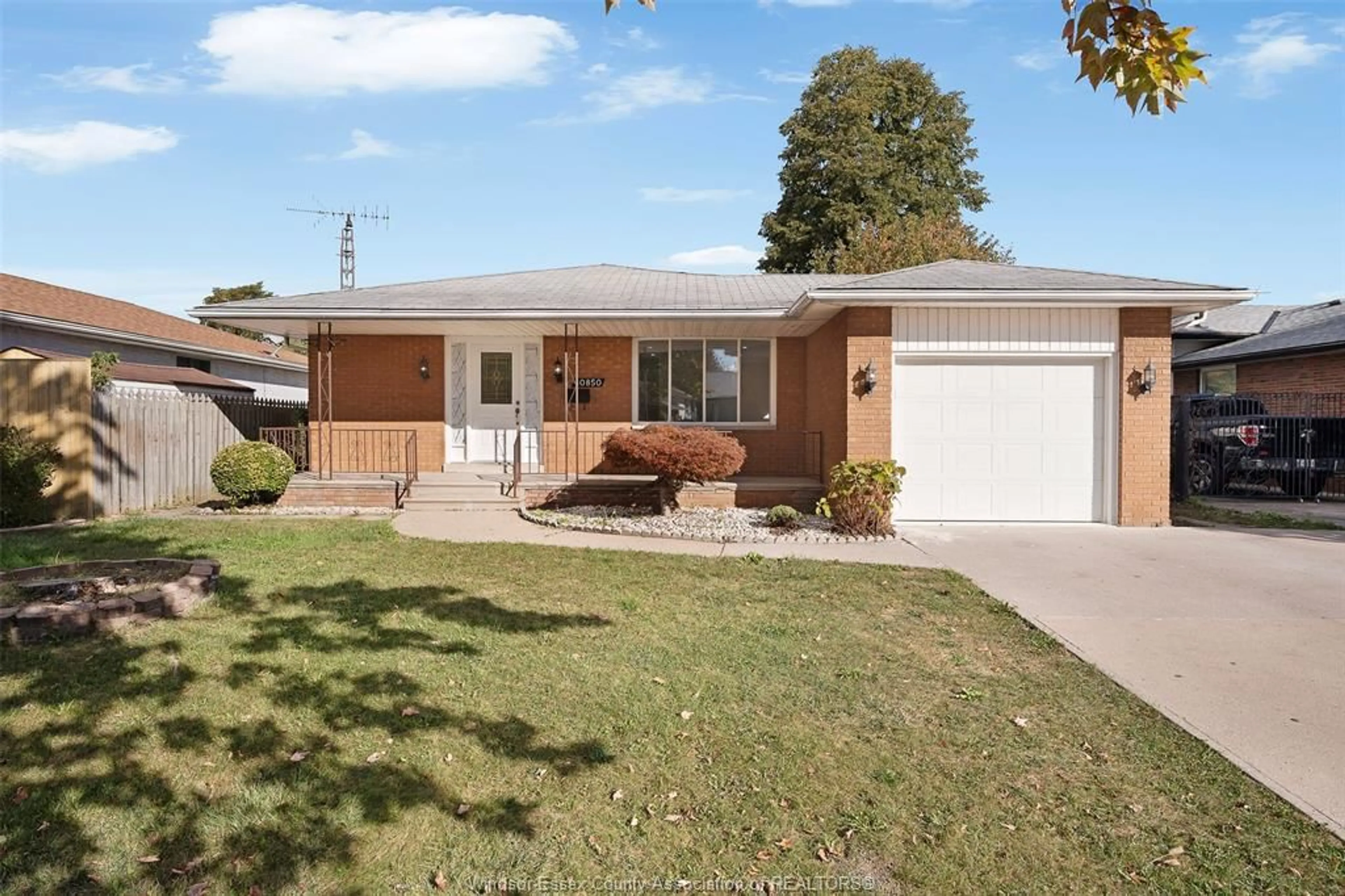 Home with brick exterior material, street for 10850 EASTCOURT Dr, Windsor Ontario N8R 1G1