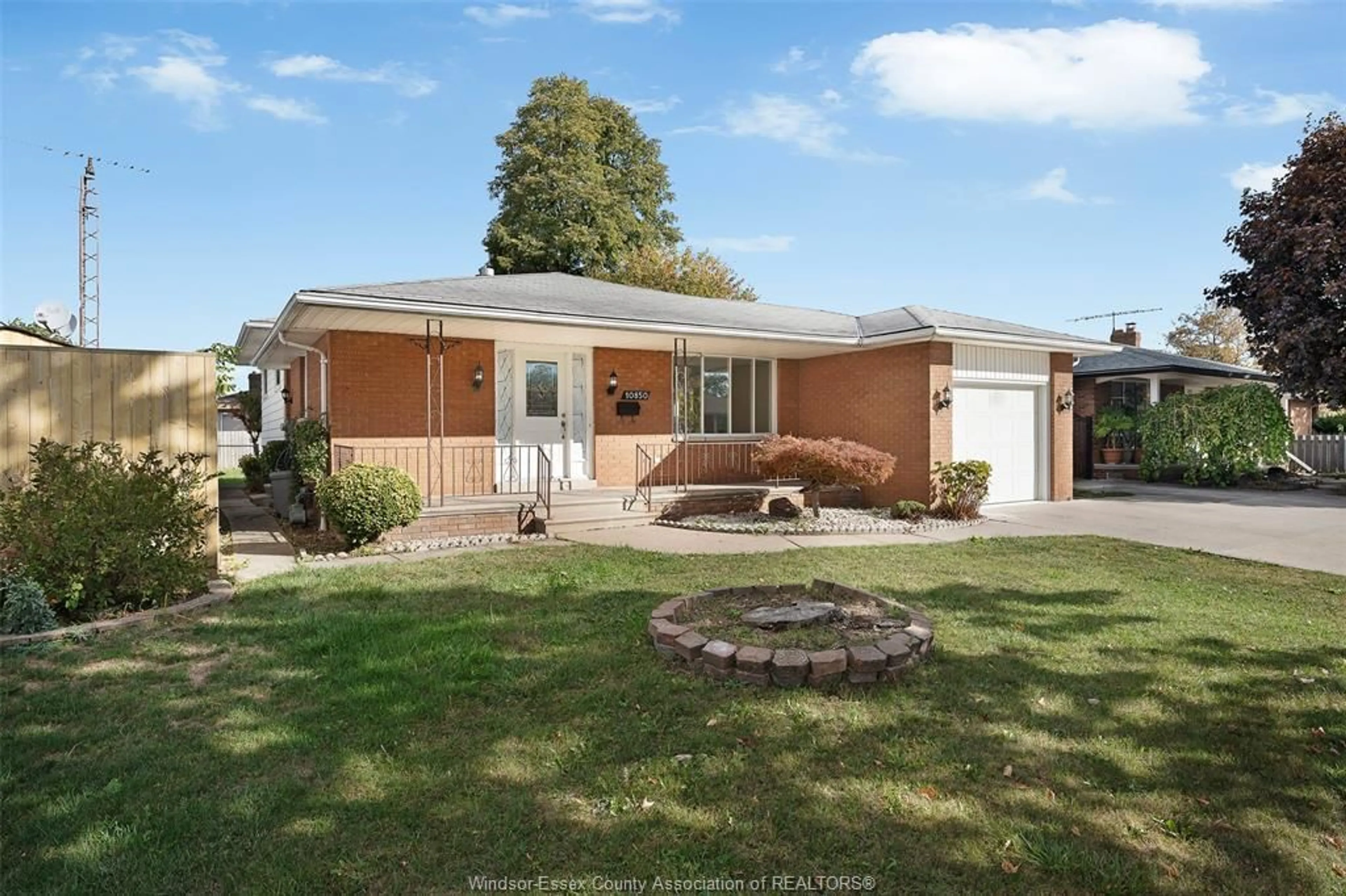 Home with brick exterior material, street for 10850 EASTCOURT Dr, Windsor Ontario N8R 1G1