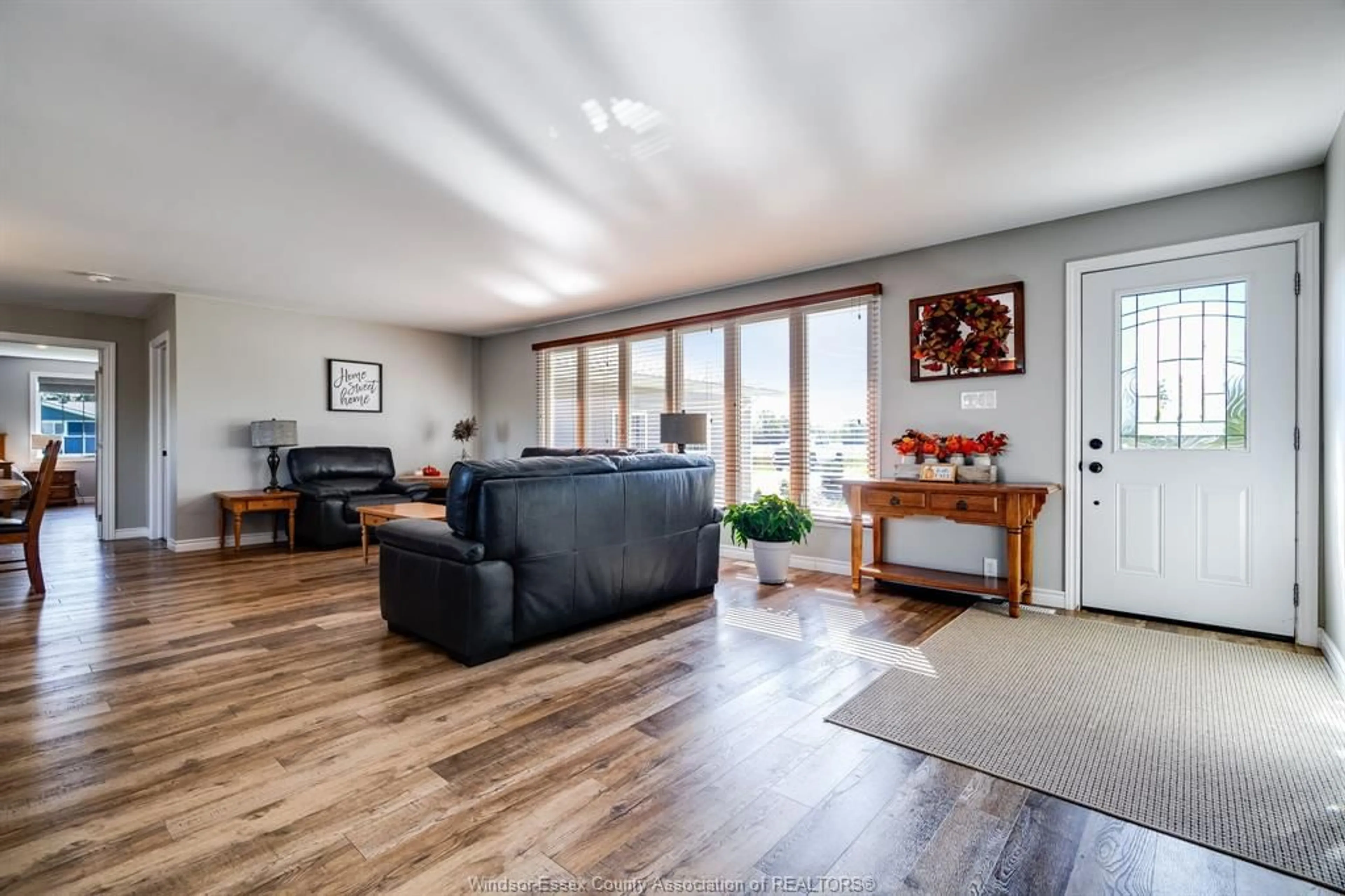Living room with furniture, wood/laminate floor for 6958 6 Concession Road, Essex Ontario N9Y 2E5