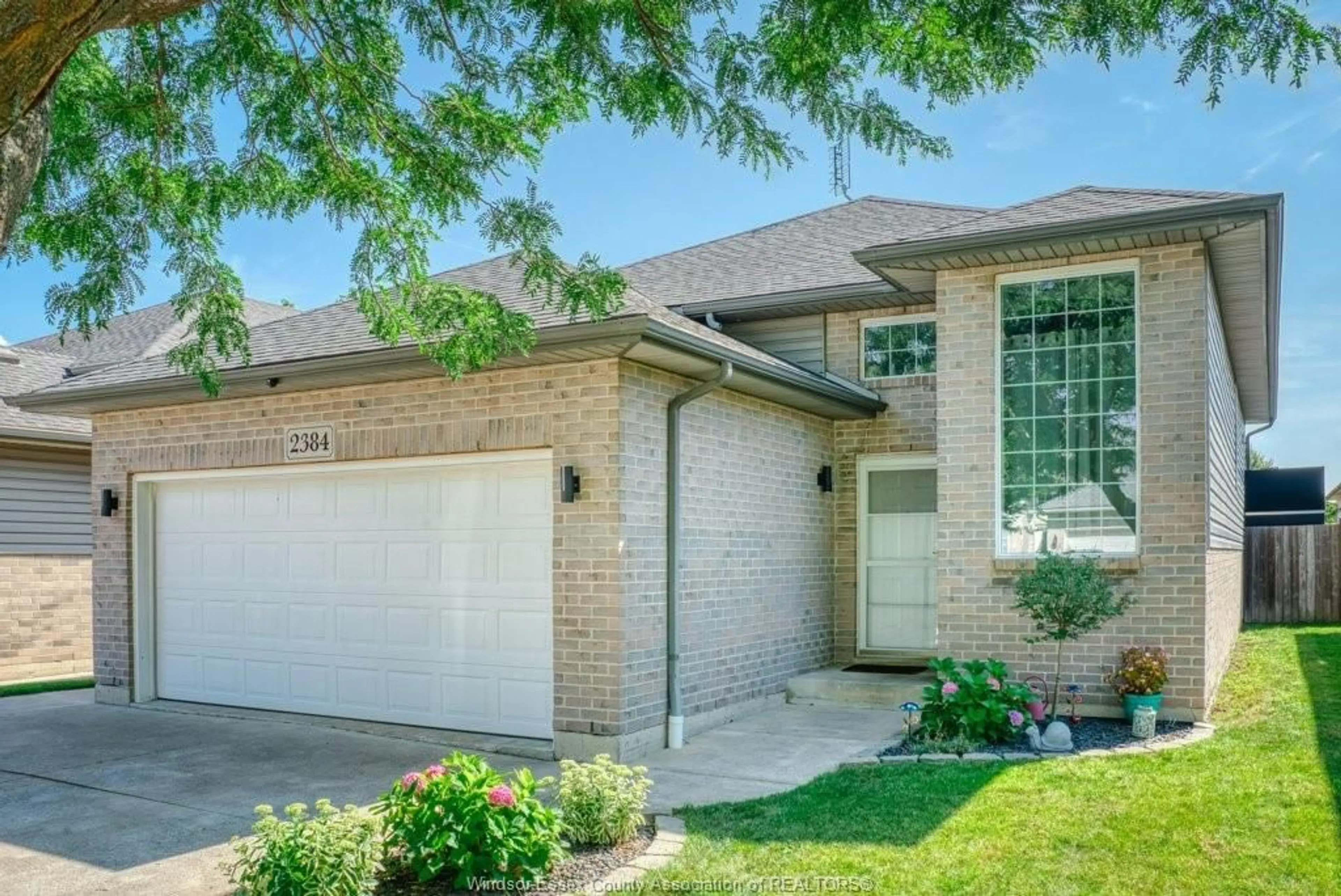Home with brick exterior material, street for 2384 RADCLIFF Ave, Windsor Ontario N8P 1V5