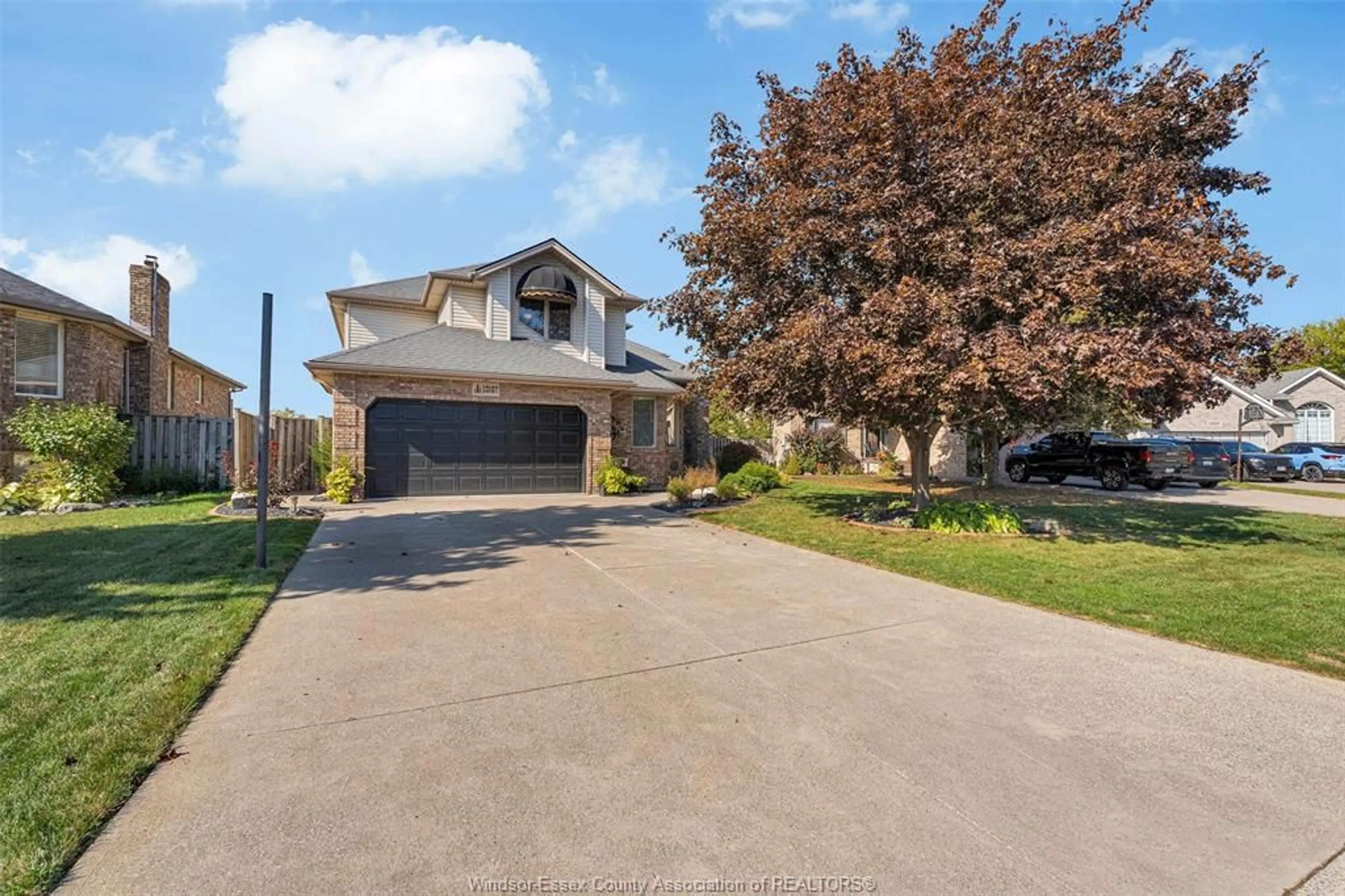 A pic from outside/outdoor area/front of a property/back of a property/a pic from drone, street for 13167 HARVEST Lane, Tecumseh Ontario N8N 4N7