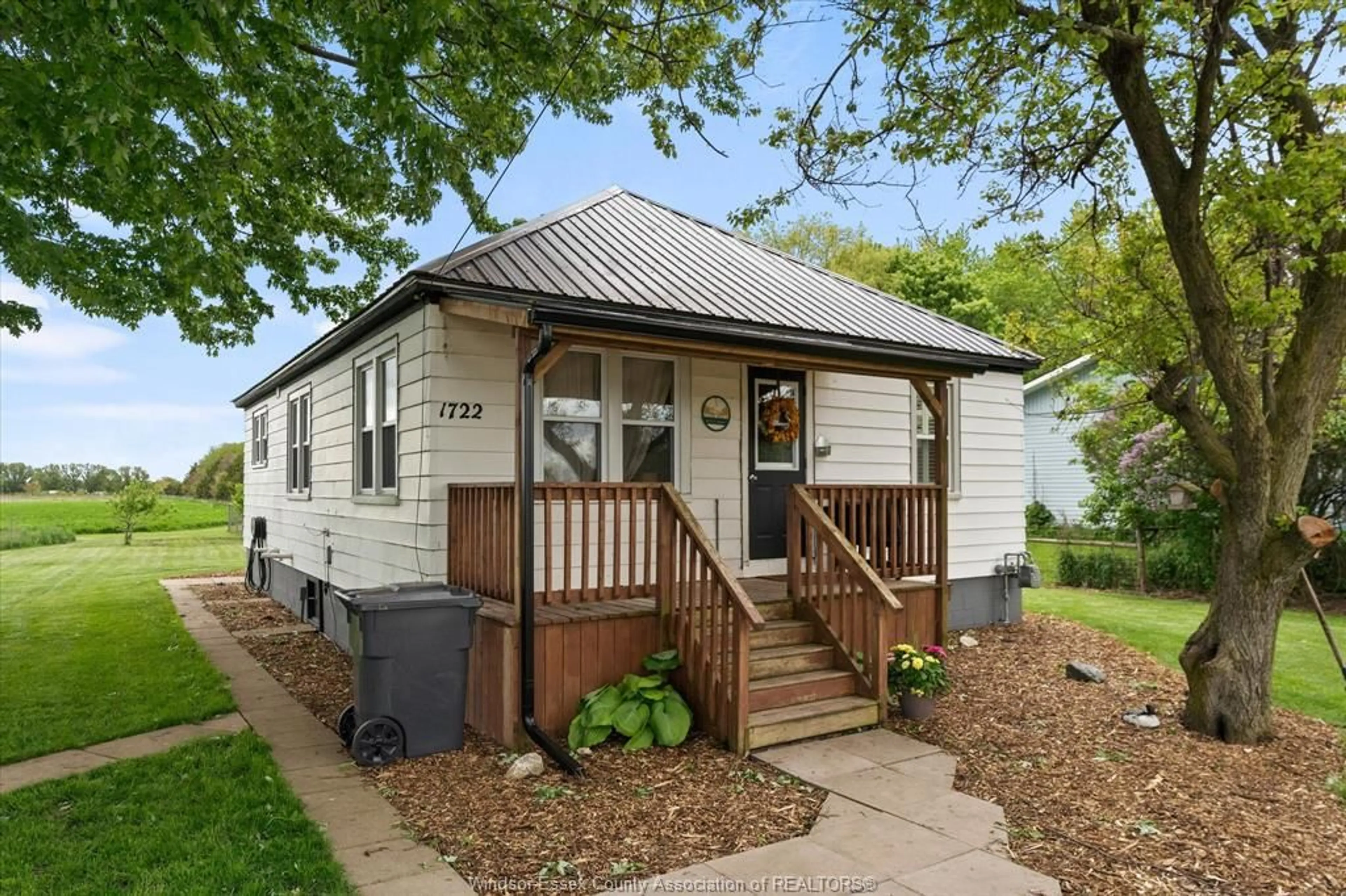 Home with vinyl exterior material, street for 1722 Mersea Rd D, Leamington Ontario N8H 3V4