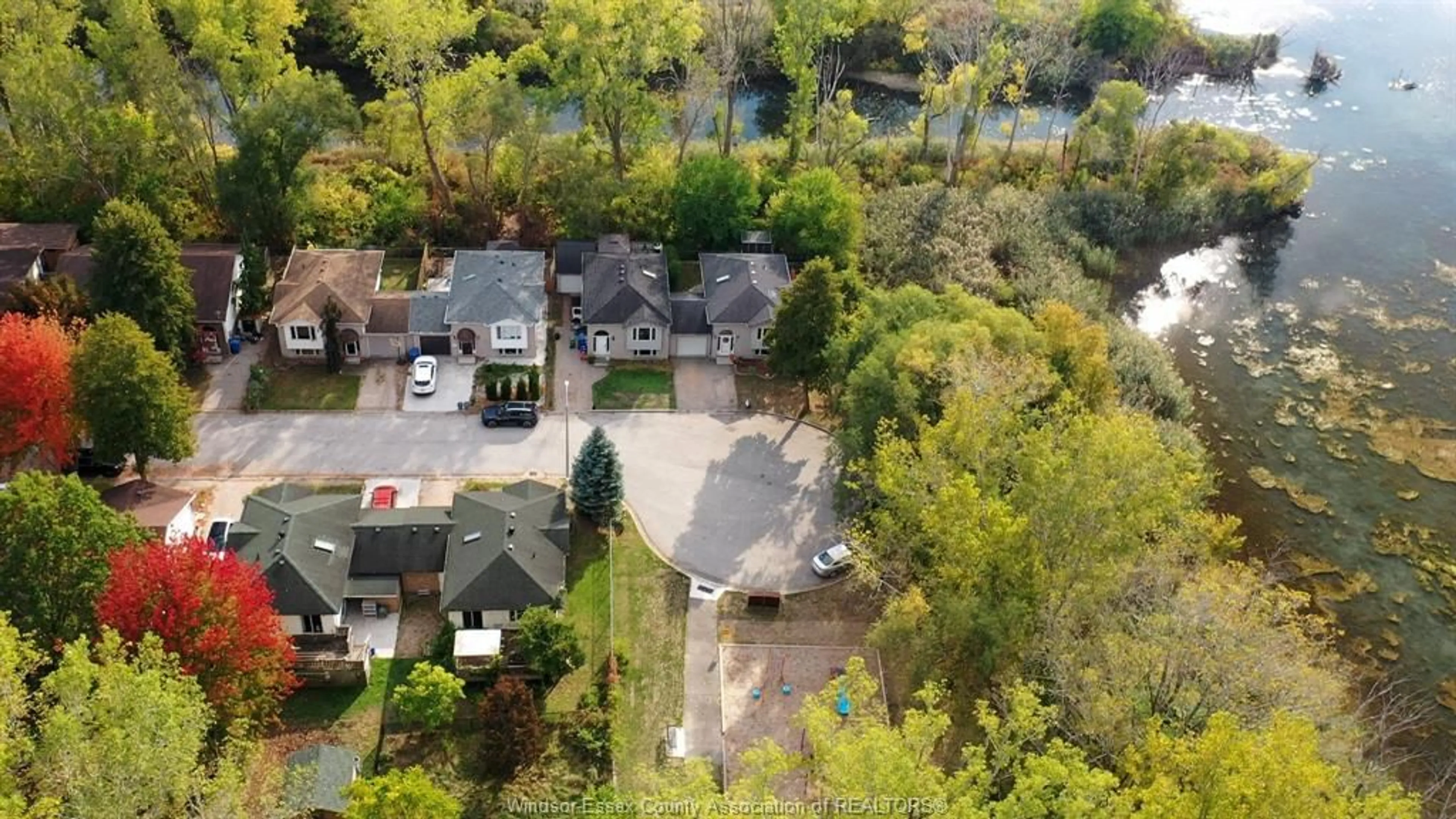 A pic from outside/outdoor area/front of a property/back of a property/a pic from drone, street for 105 Rivervilla Crt, LaSalle Ontario N9J 3N8