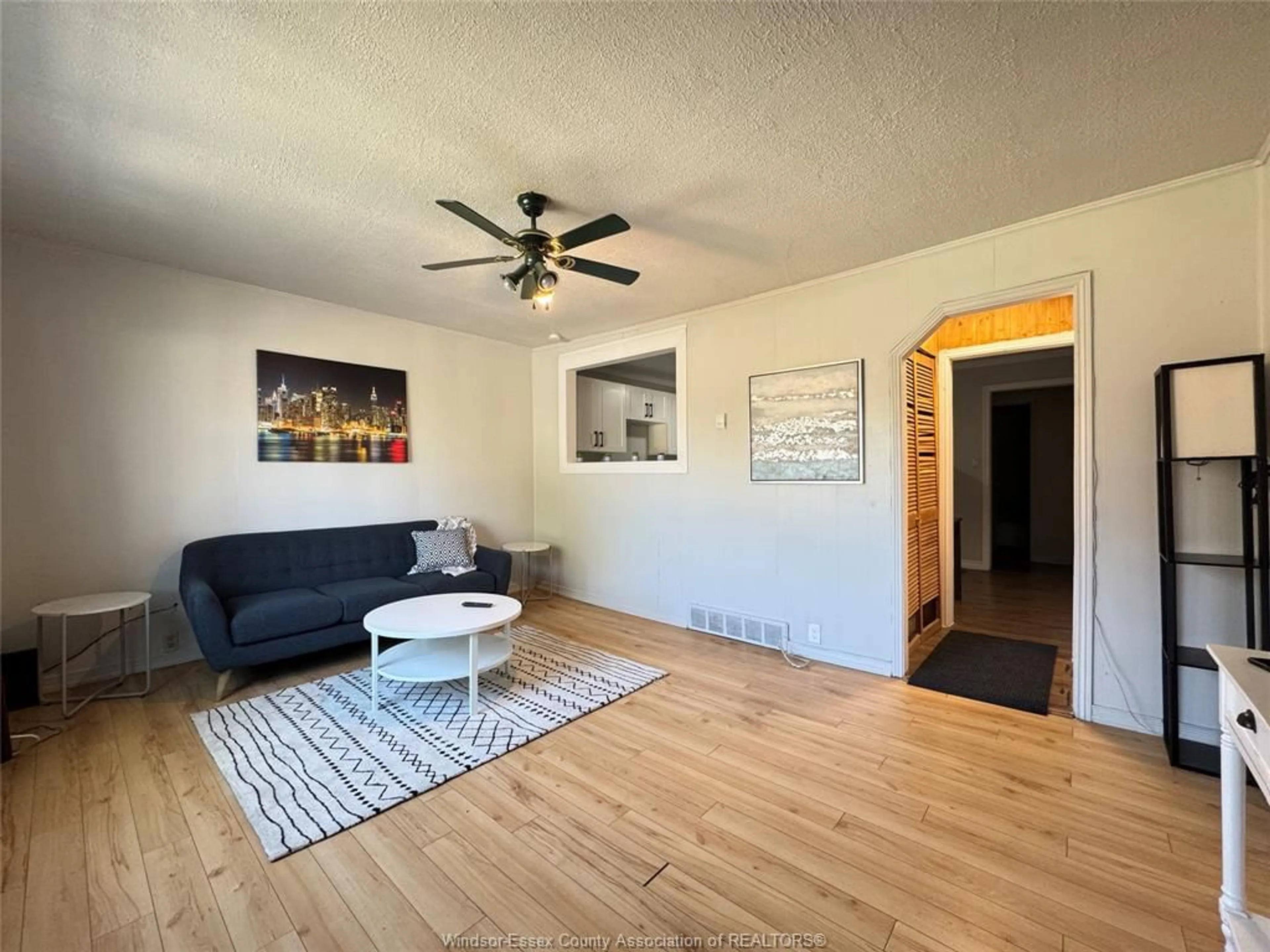 Living room with furniture, wood/laminate floor for 255 ELLIOTT, Windsor Ontario N9A 3R7