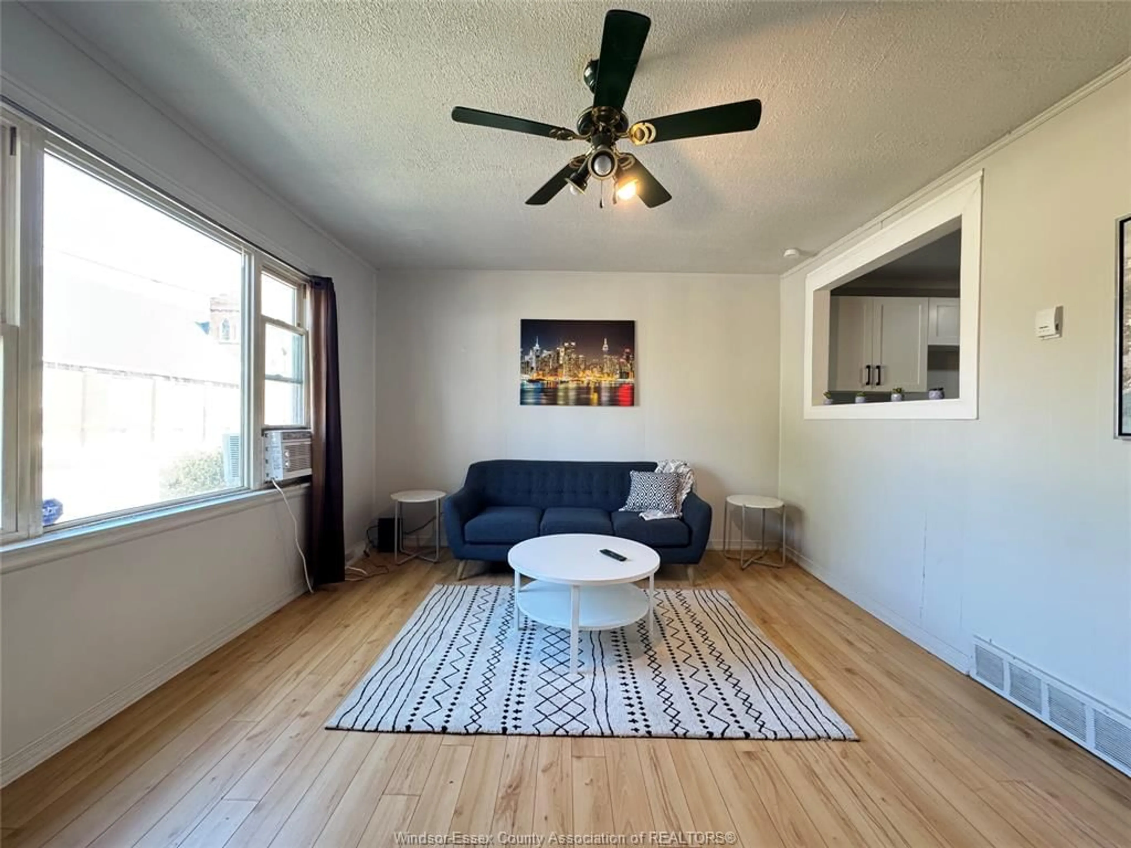 Living room with furniture, wood/laminate floor for 255 ELLIOTT, Windsor Ontario N9A 3R7