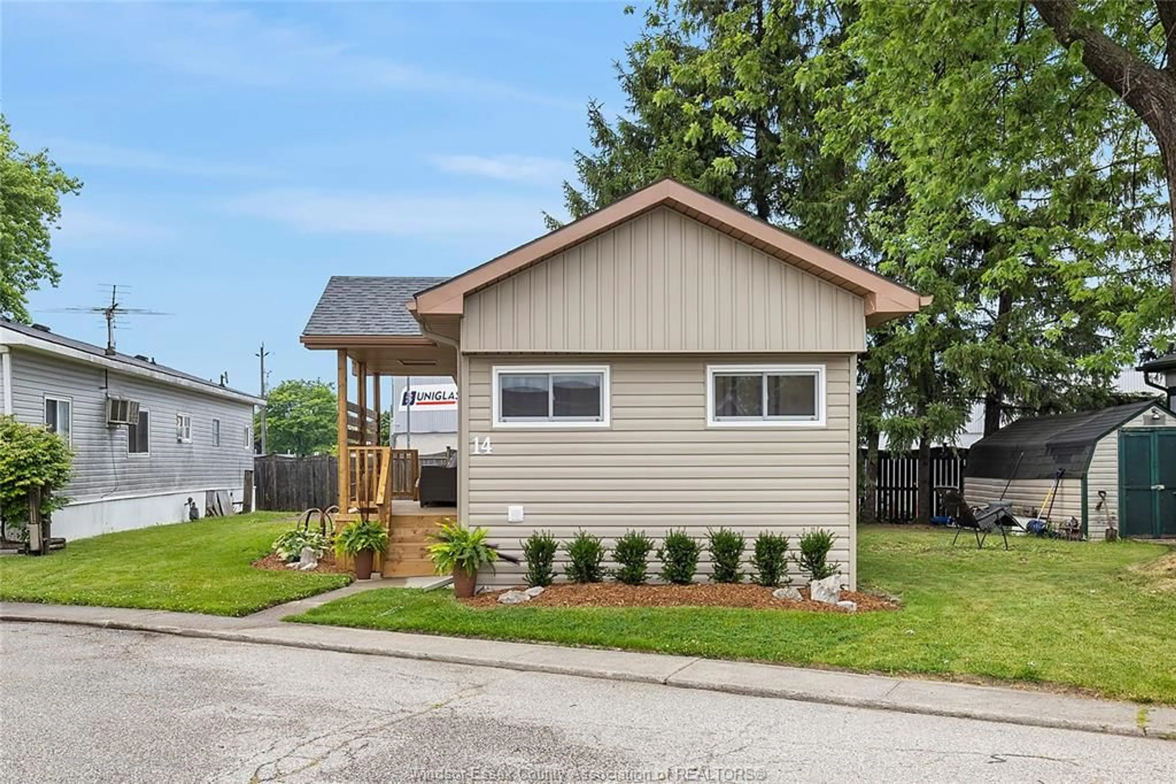 Home with vinyl exterior material, street for 14 ROBIN Cres, Lakeshore Ontario N0R 1A0