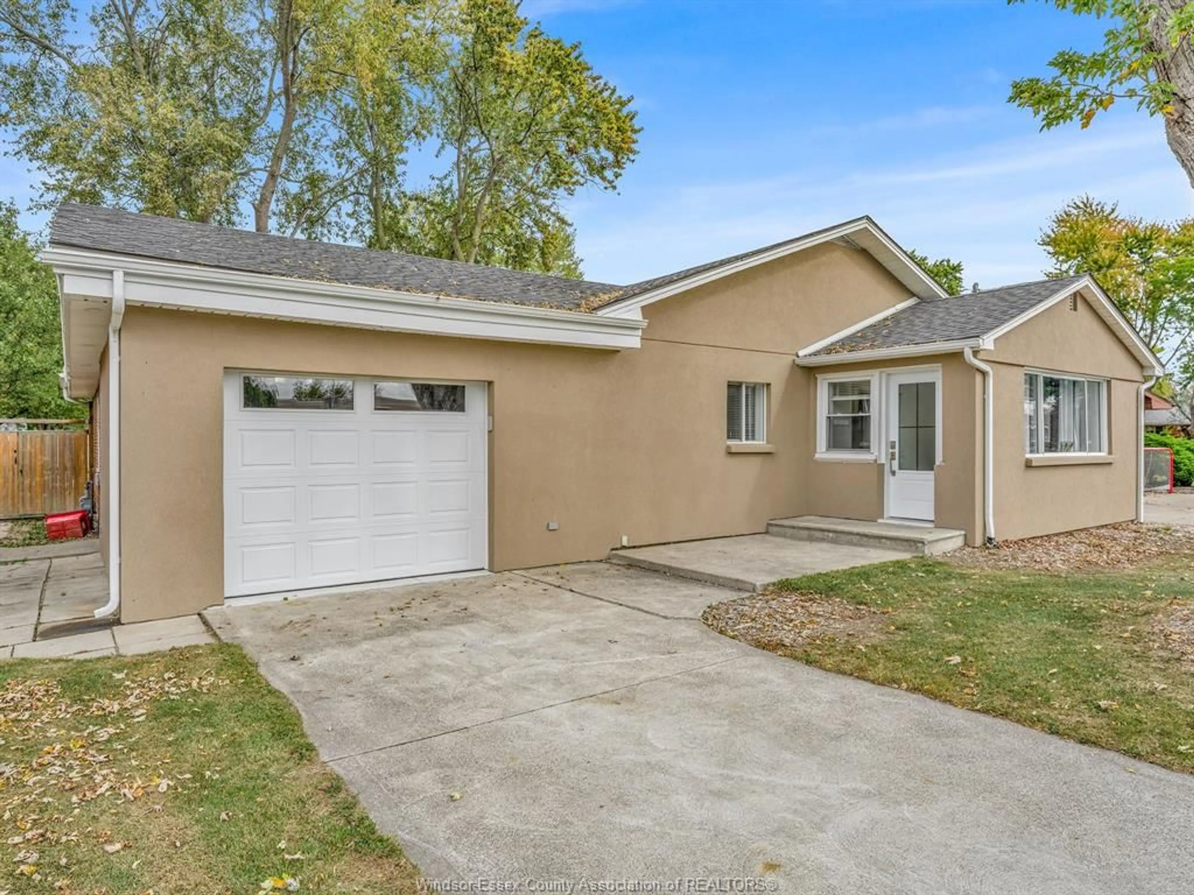 Home with vinyl exterior material, street for 1212 FAITH Dr, Lakeshore Ontario N0R 1A0