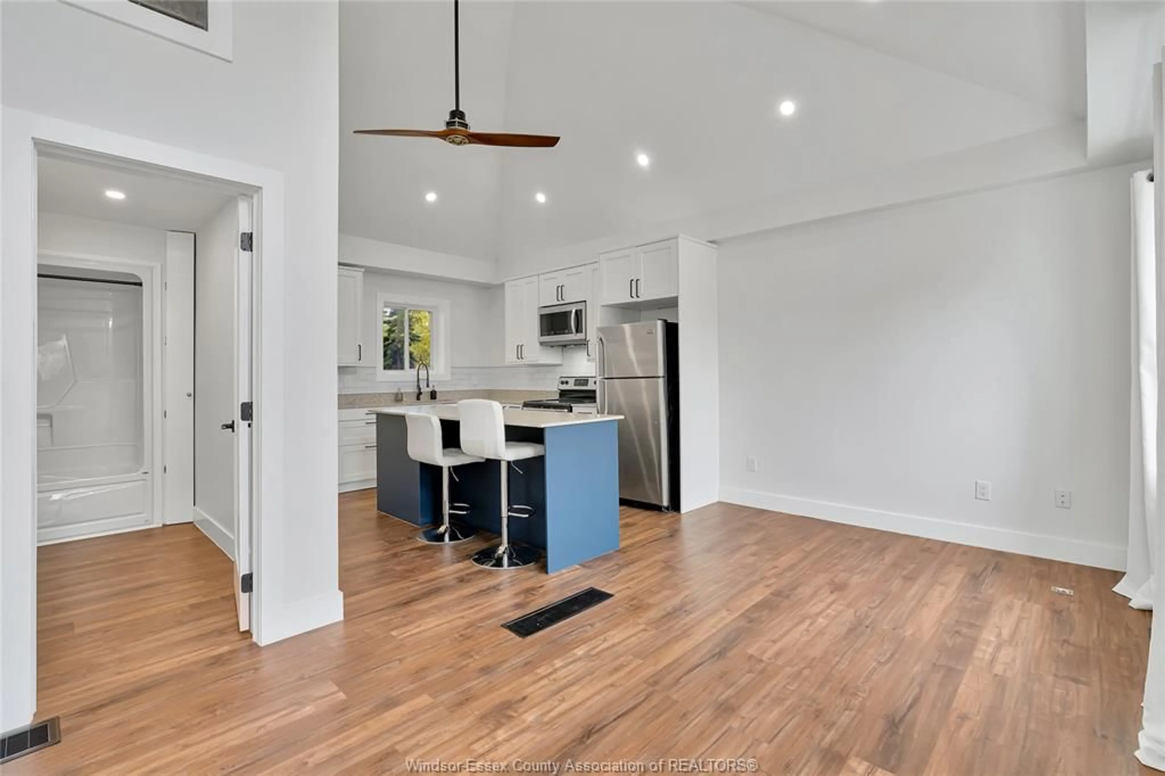 Open concept kitchen, wood/laminate floor for 12429 MCNORTON St, Tecumseh Ontario N8N 1J7