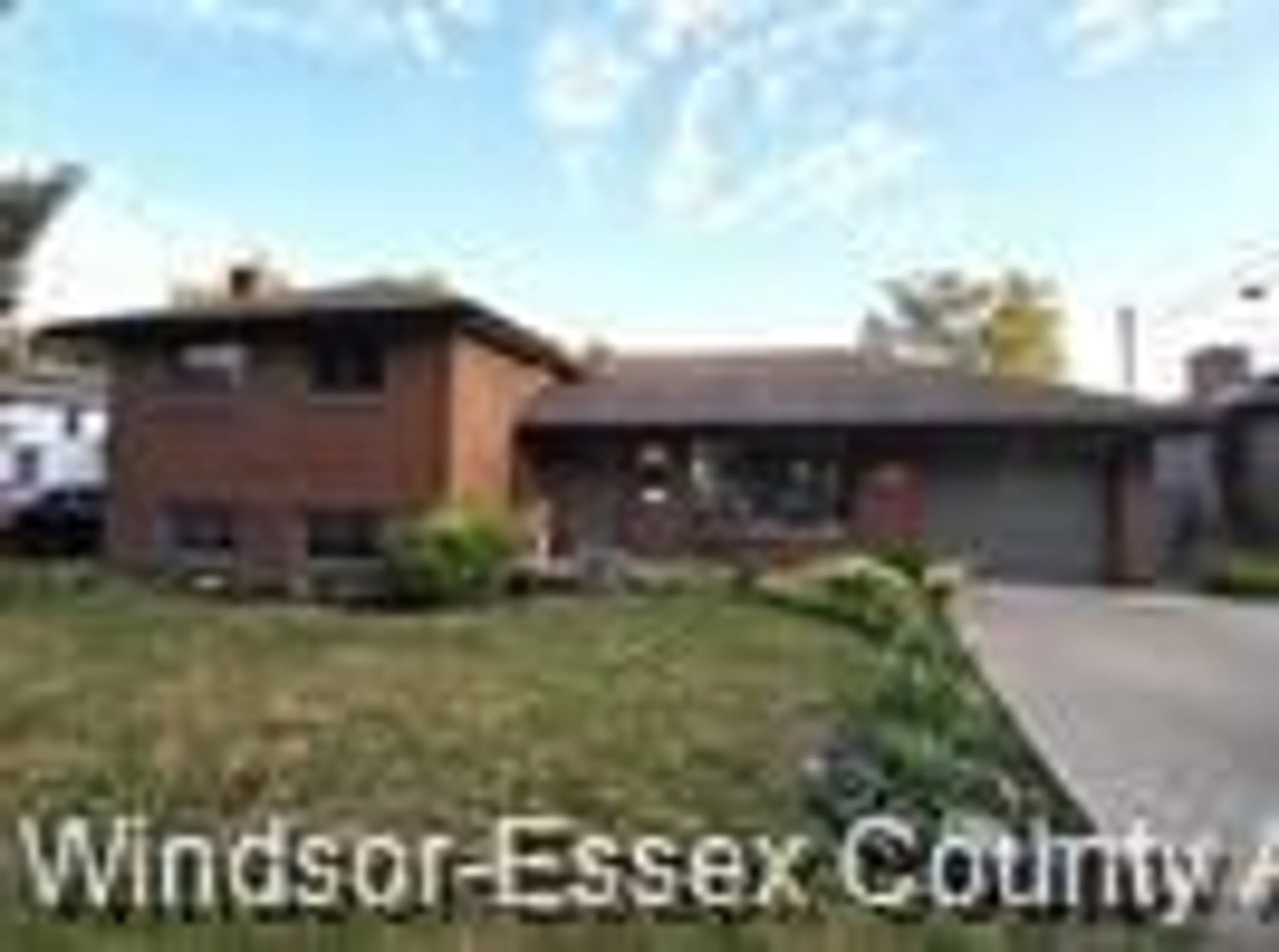 Home with brick exterior material, street for 353 Cousineau Rd, Windsor Ontario N9G 1V6