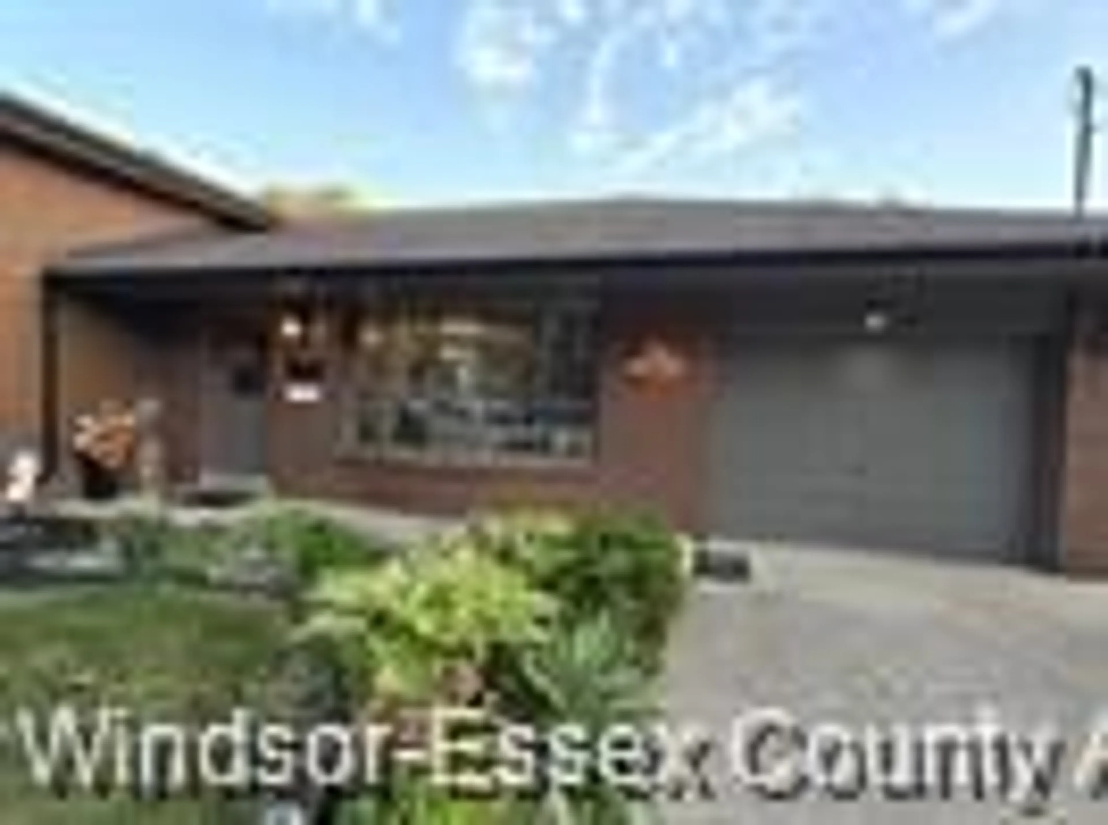 Home with brick exterior material, street for 353 Cousineau Rd, Windsor Ontario N9G 1V6