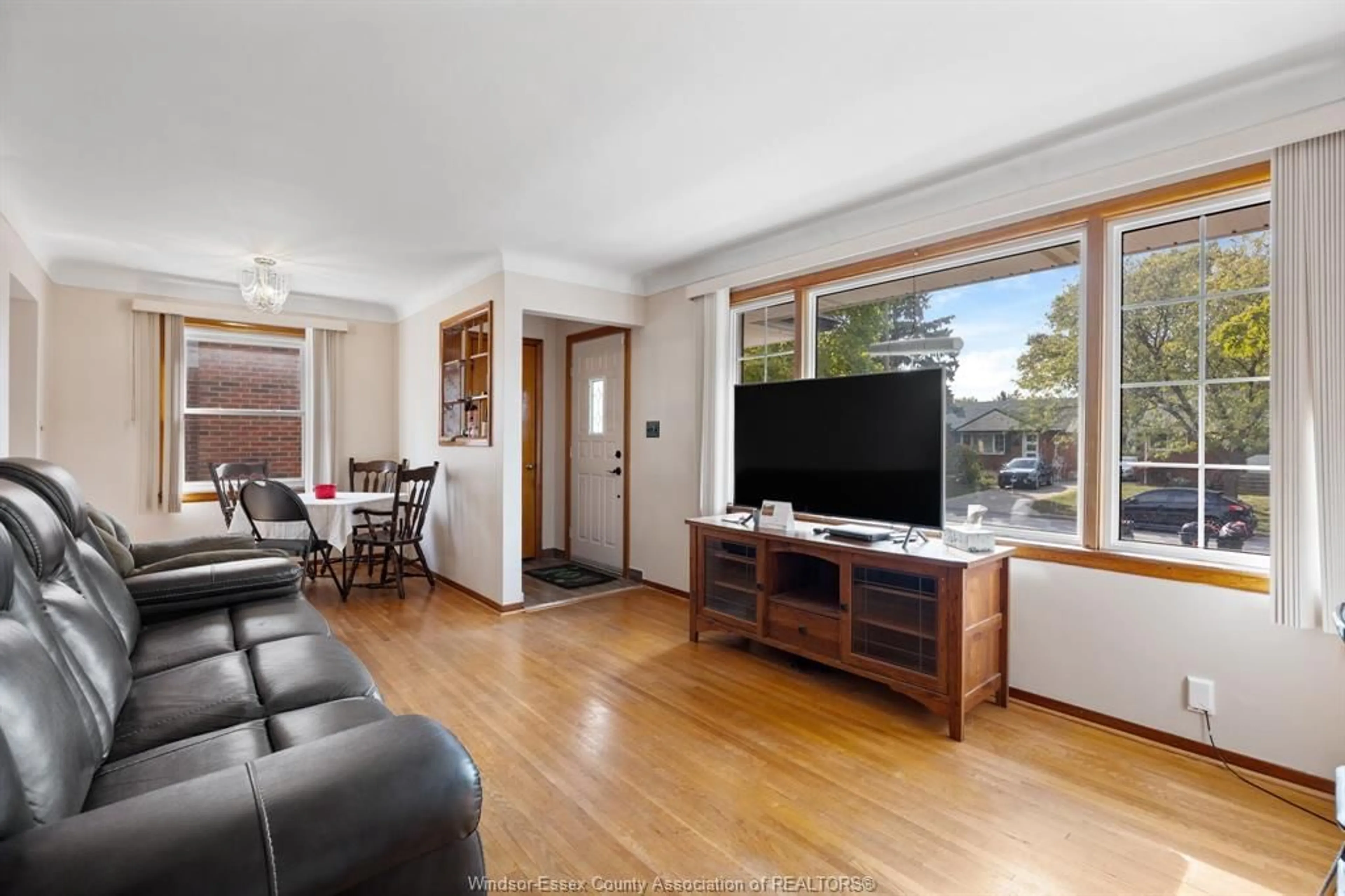 Living room with furniture, wood/laminate floor for 1160 Isabelle Pl, Windsor Ontario N8S 3B4