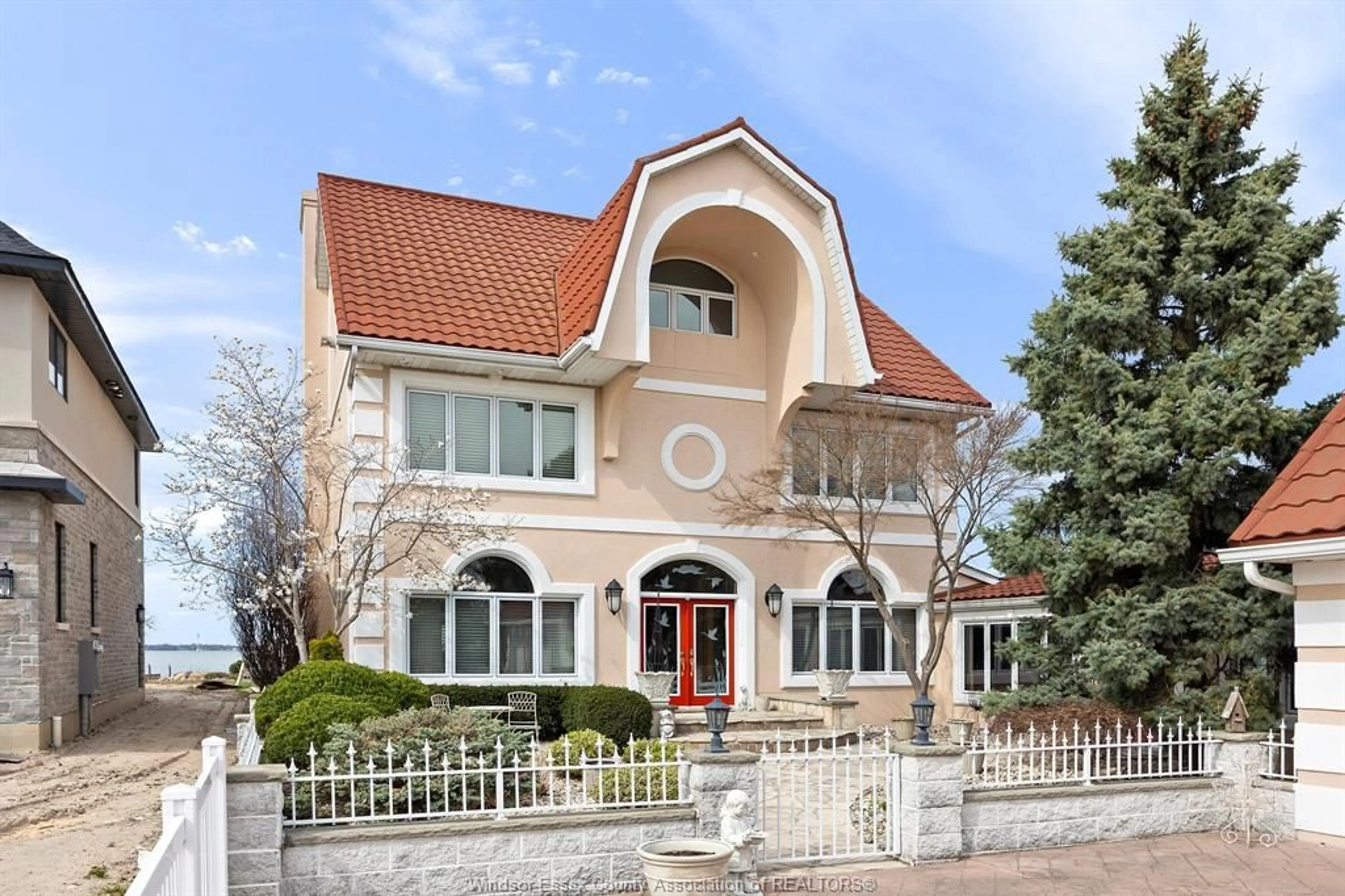 Home with brick exterior material, street for 10960 RIVERSIDE Dr, Windsor Ontario N8P 1A4