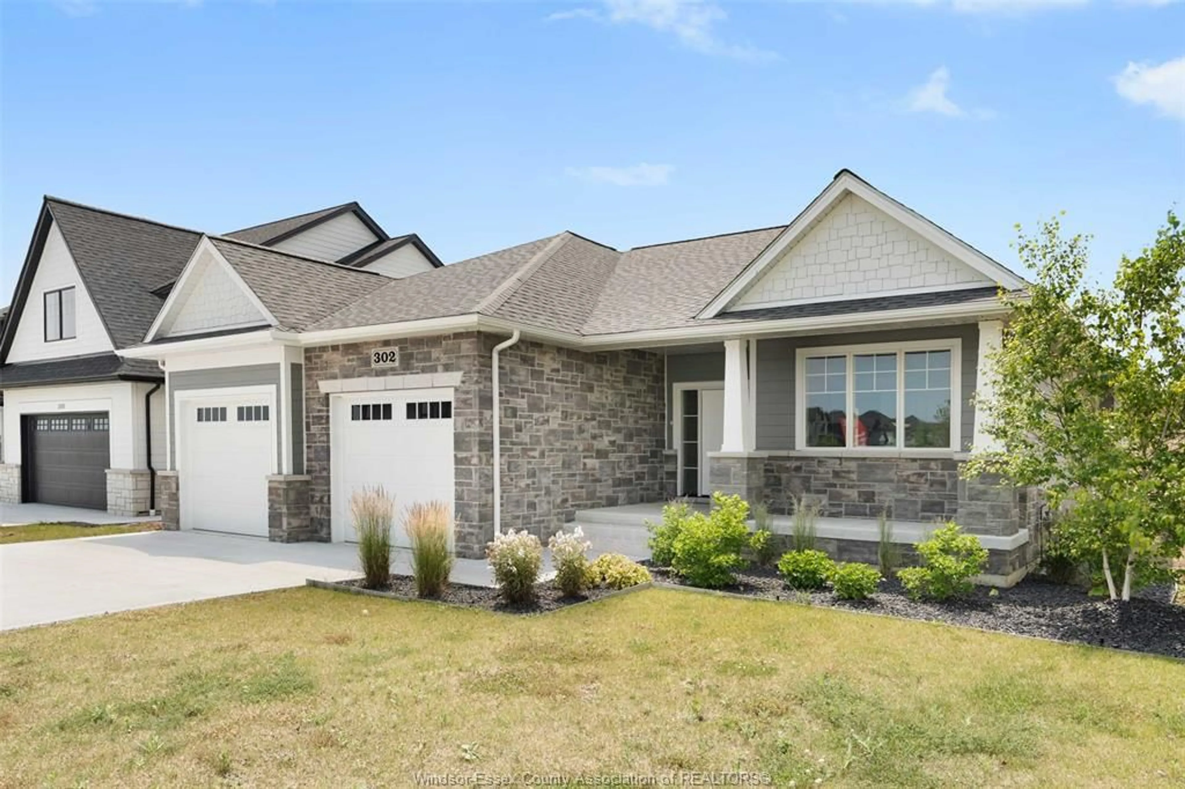 Home with brick exterior material, street for 302 BLAKE Ave, Belle River Ontario N0R 1A0