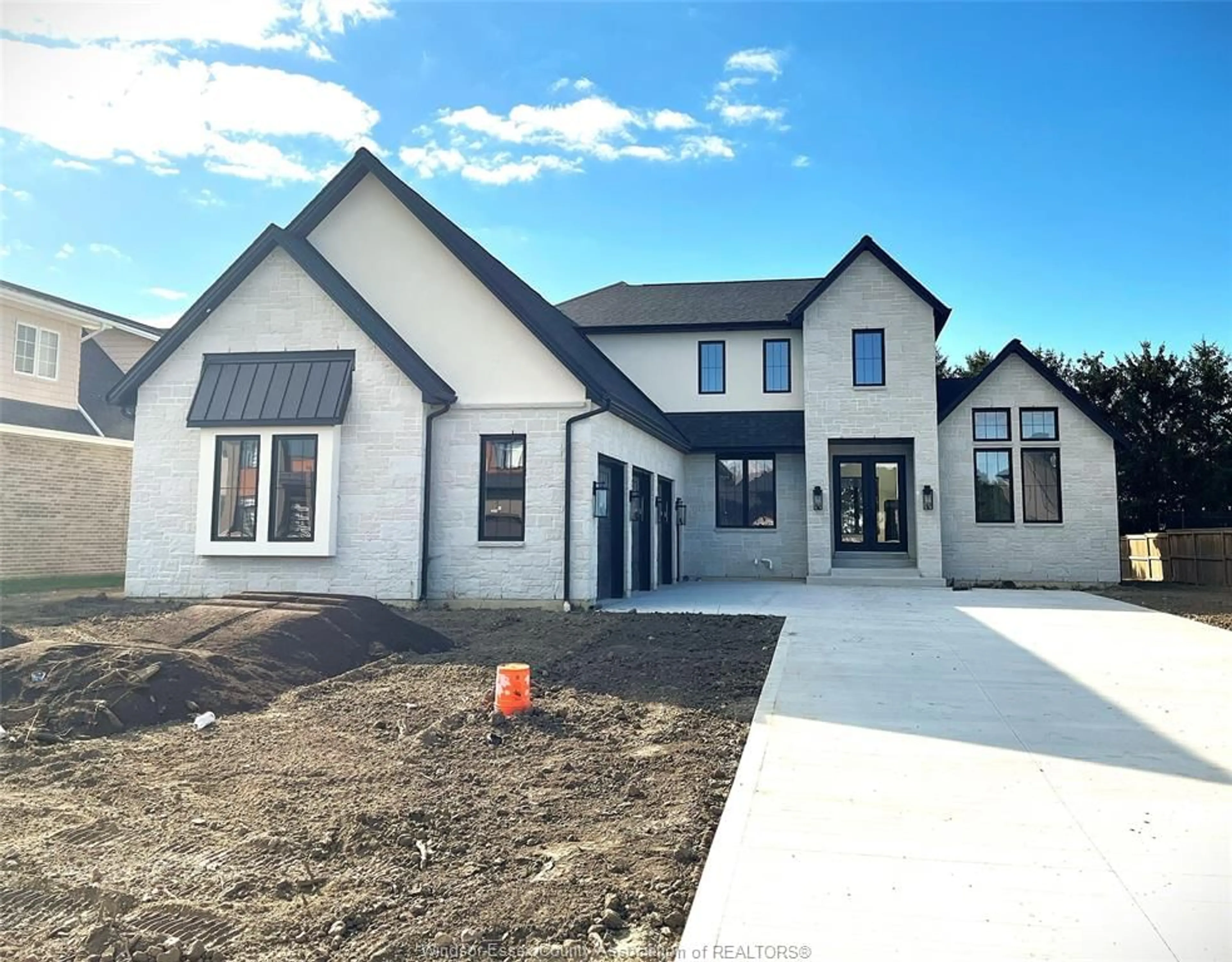 Home with brick exterior material, street for 1443 MULLINS Dr, Lakeshore Ontario N0R 1V0