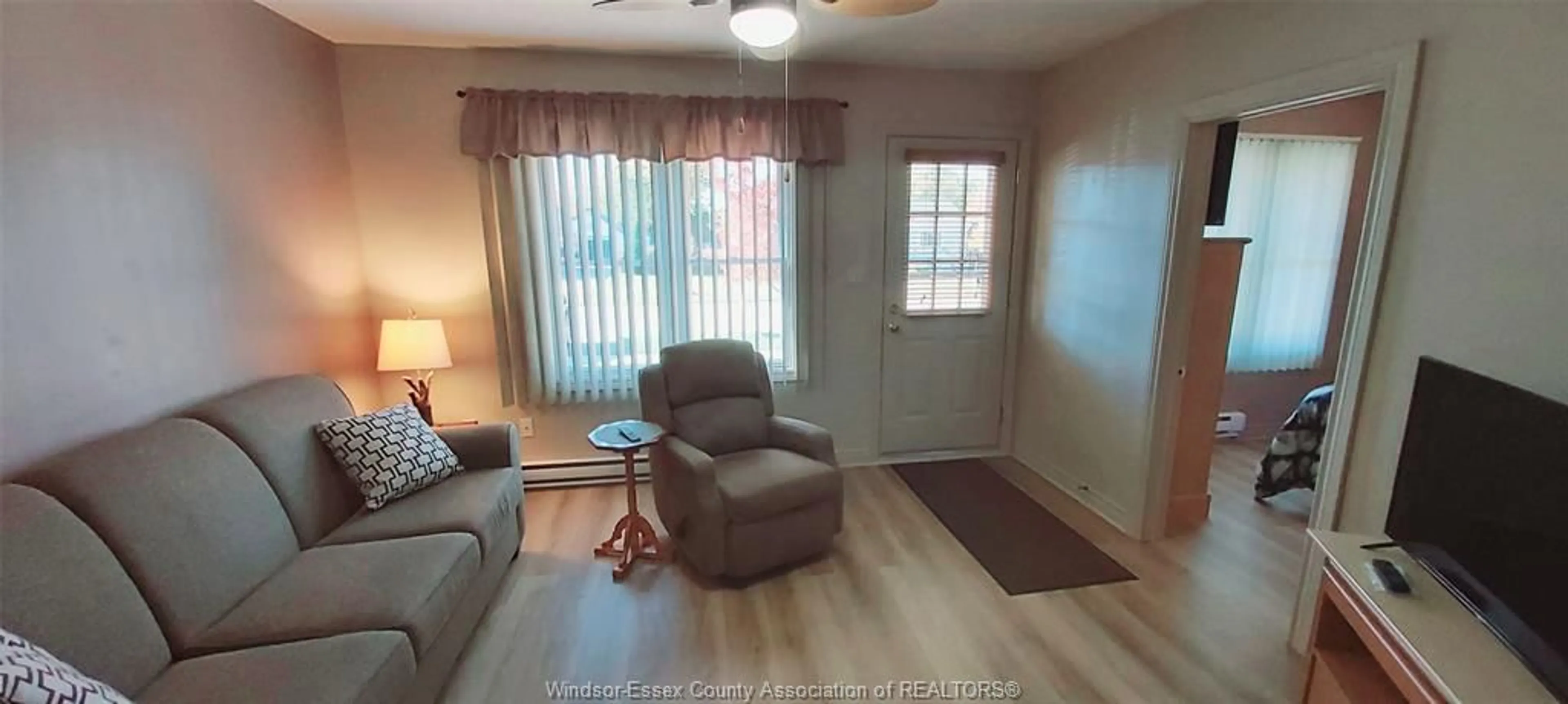 Living room with furniture, wood/laminate floor for 670 LABUTE St, Tecumseh Ontario N8N 2B3