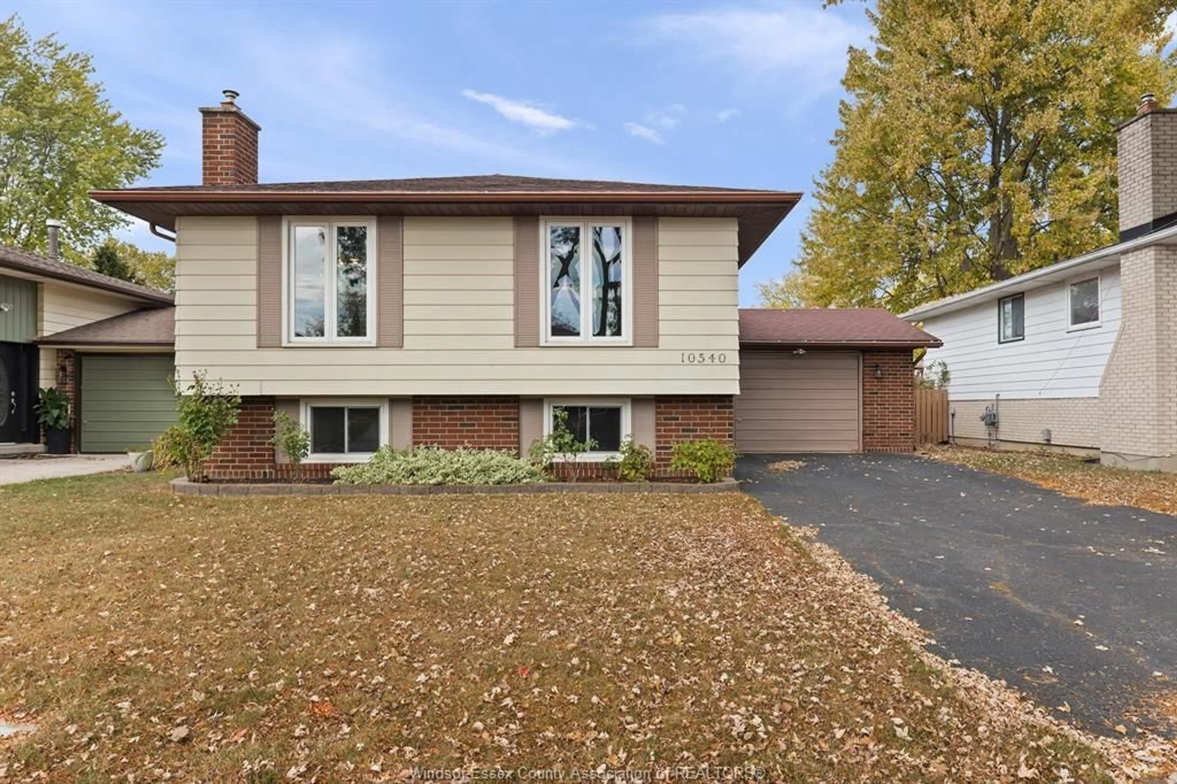 Home with vinyl exterior material, street for 10540 PALMS Cres, Windsor Ontario N8R 2E8