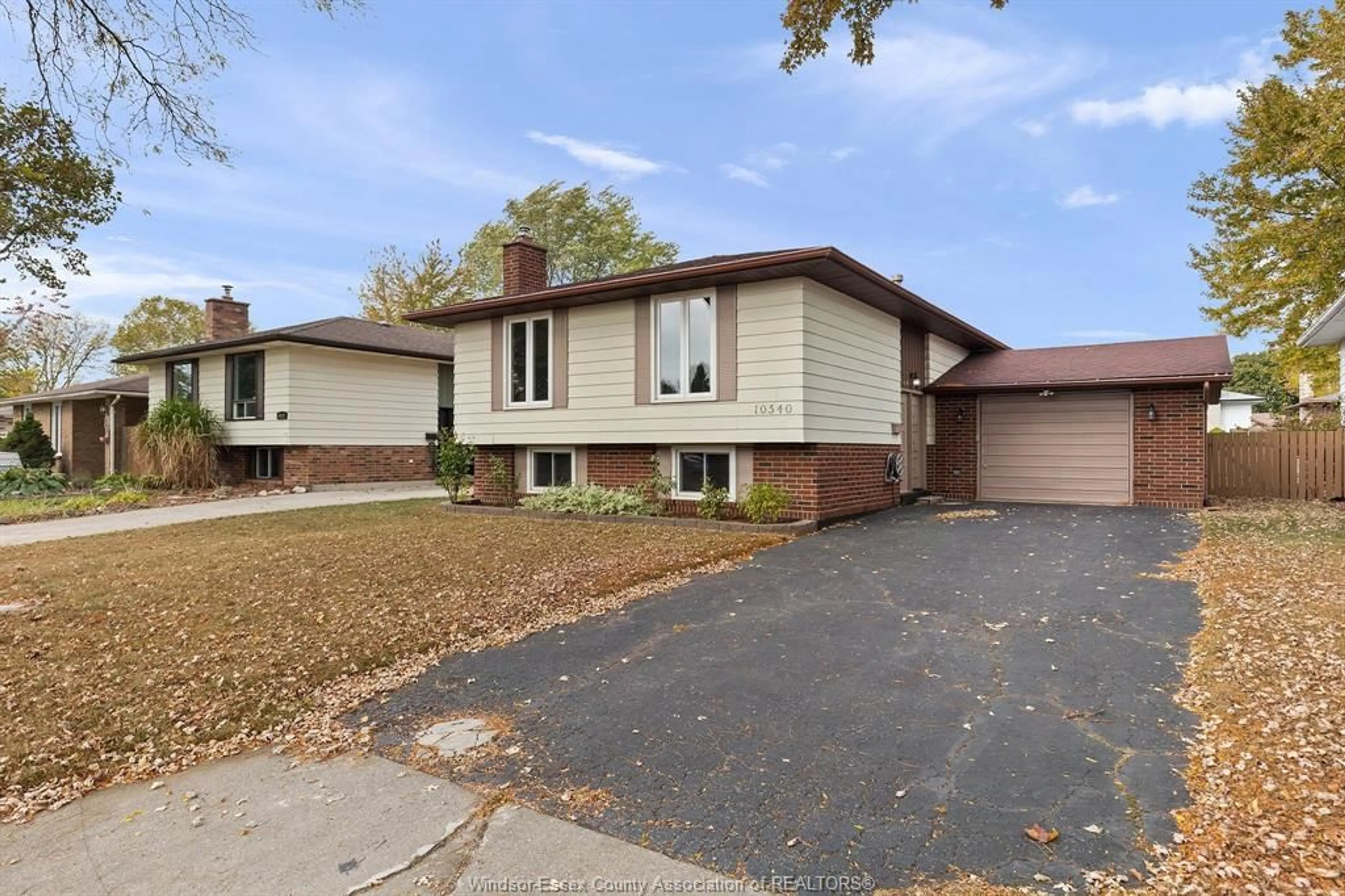 Home with vinyl exterior material, street for 10540 PALMS Cres, Windsor Ontario N8R 2E8