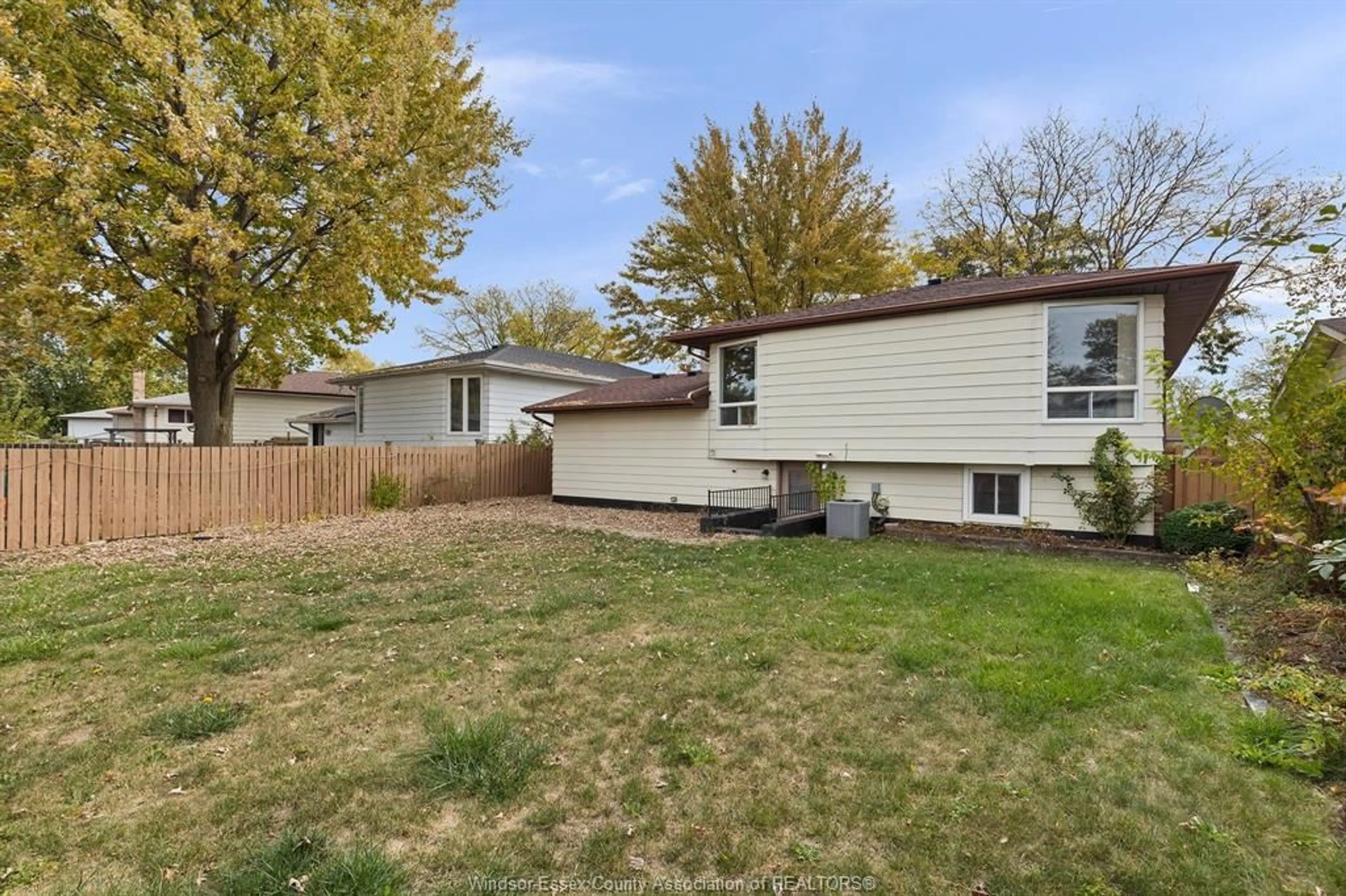 Home with vinyl exterior material, street for 10540 PALMS Cres, Windsor Ontario N8R 2E8