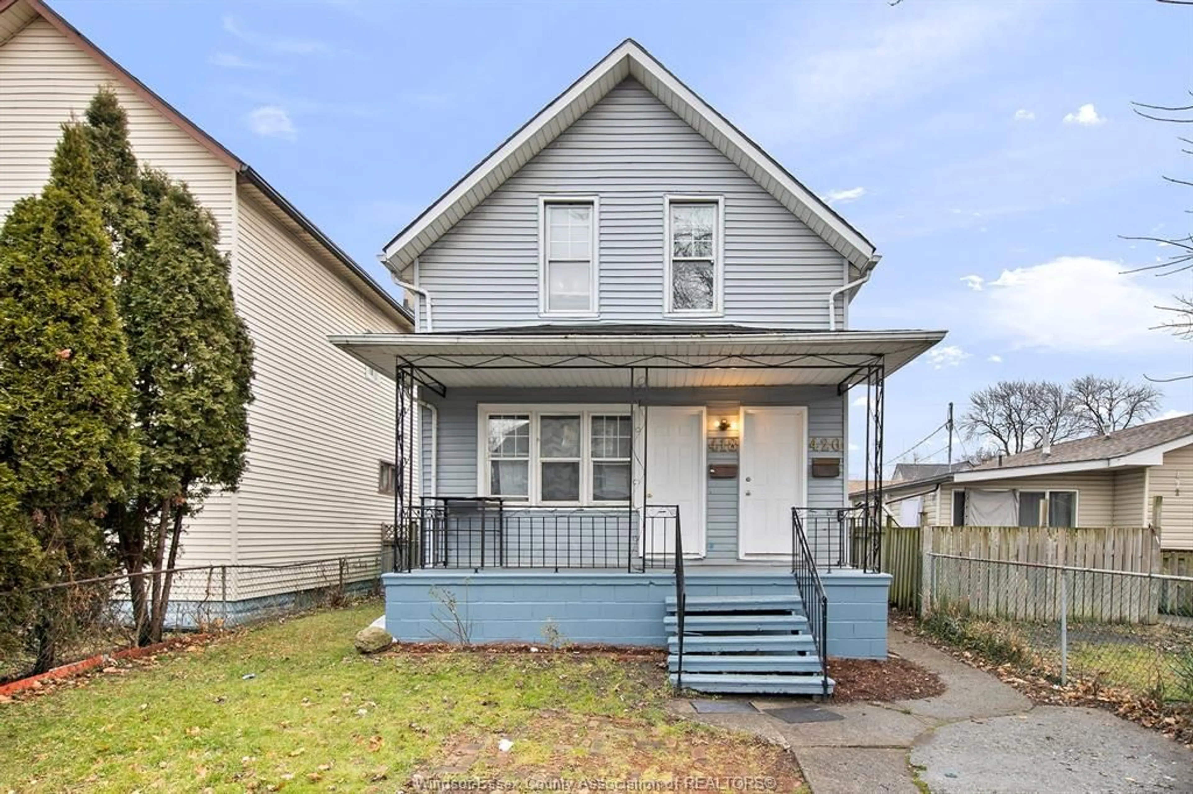 Home with vinyl exterior material, street for 418-420 Caron Ave, Windsor Ontario N9B 2Y5