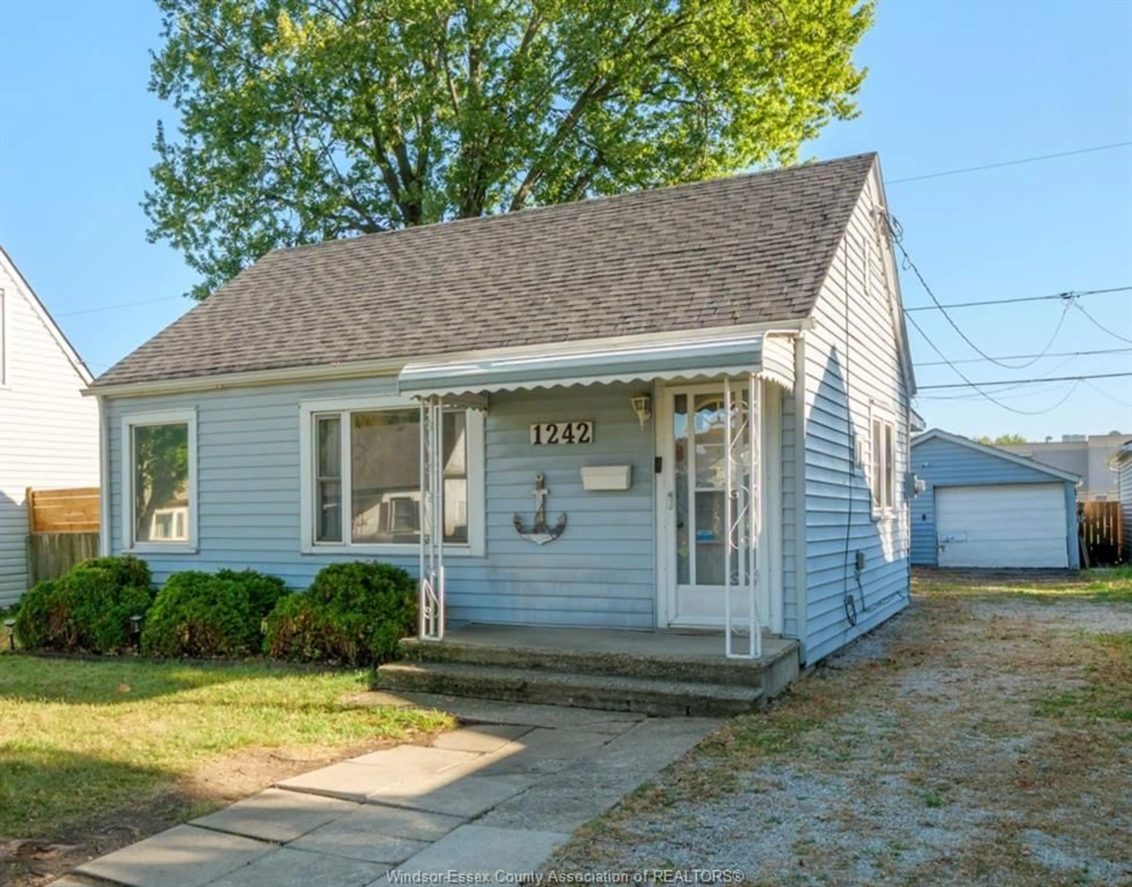 Home with vinyl exterior material, street for 1242 PARTINGTON Ave, Windsor Ontario N9B 2P4
