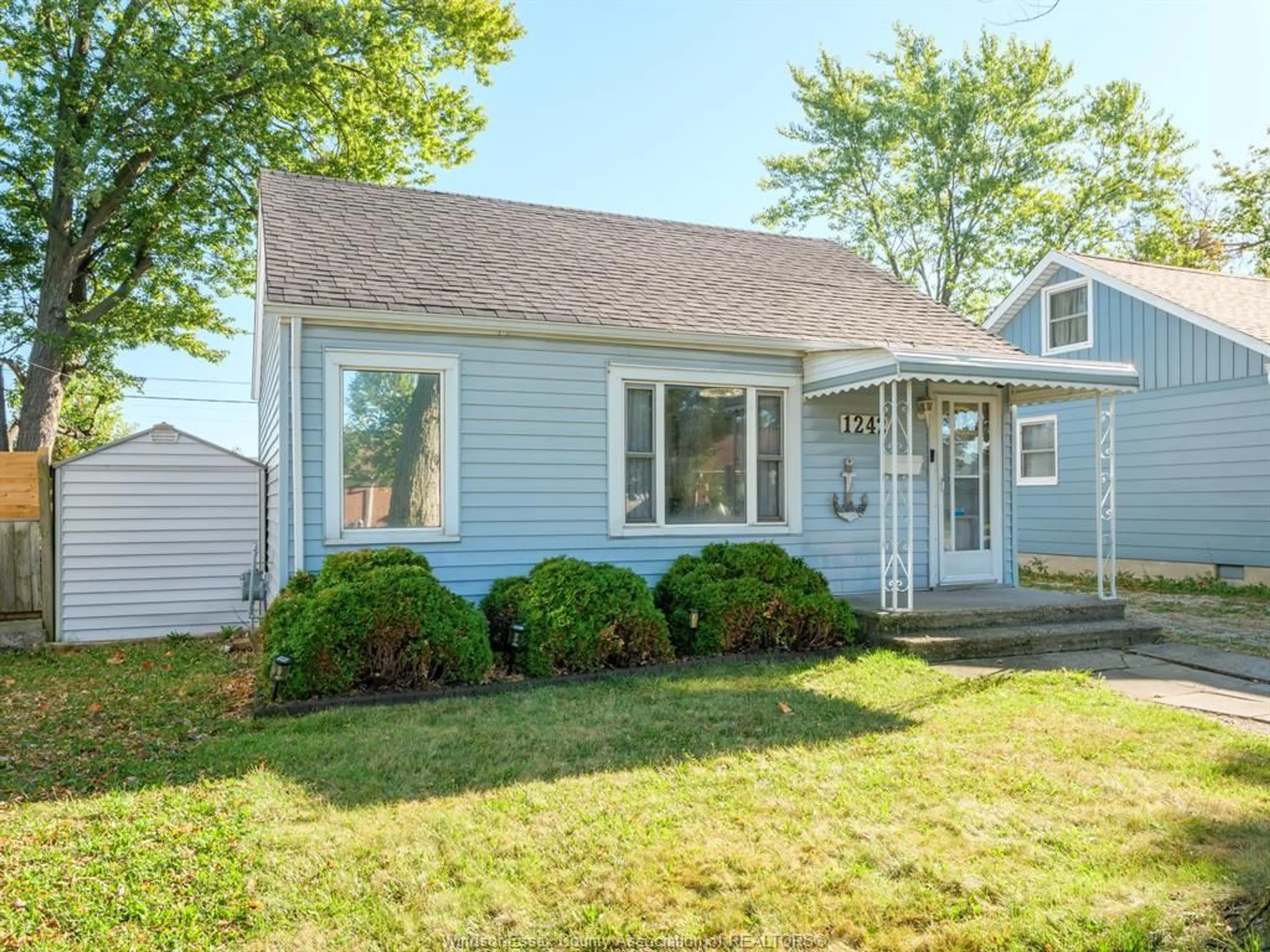 Home with vinyl exterior material, street for 1242 PARTINGTON Ave, Windsor Ontario N9B 2P4