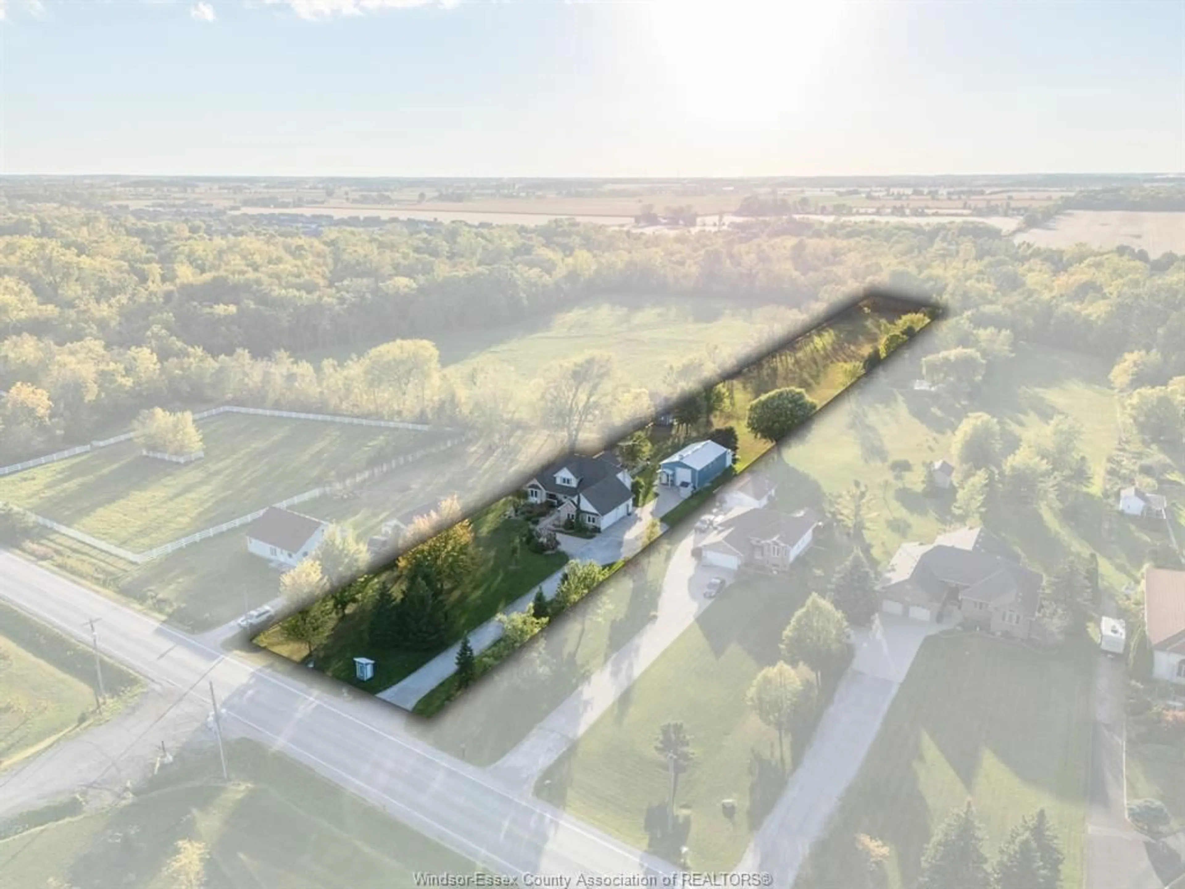 A pic from outside/outdoor area/front of a property/back of a property/a pic from drone, street for 2115 County Rd 27, Lakeshore Ontario N0R 1V0
