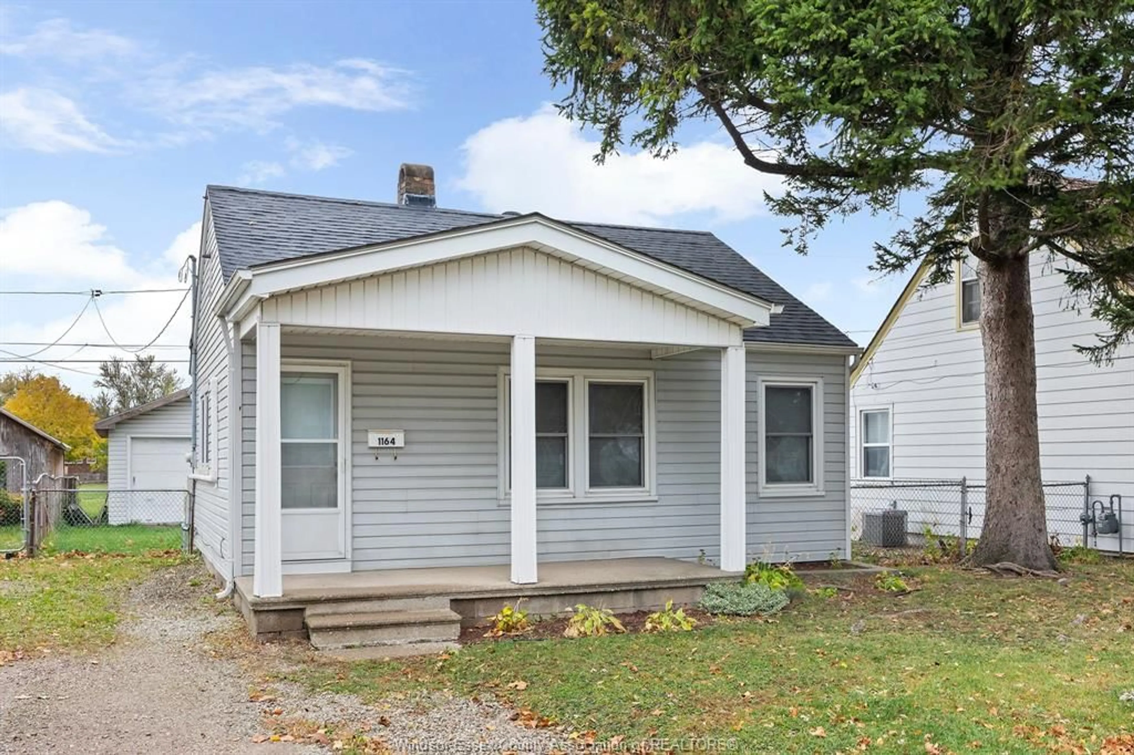 Home with vinyl exterior material, street for 1146 Partington, Windsor Ontario N9B 2P4